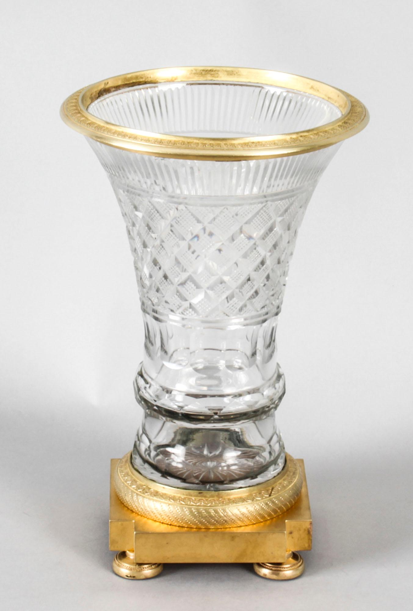 A superb quality antique French cut crystal and ormolu mounted Borghese Campana vase, circa 1830 in date. 

The trumpet shaped vase features hobnail-cut clear crystal glass design with a scalloped ormolu mouth on fillet and square section plinth