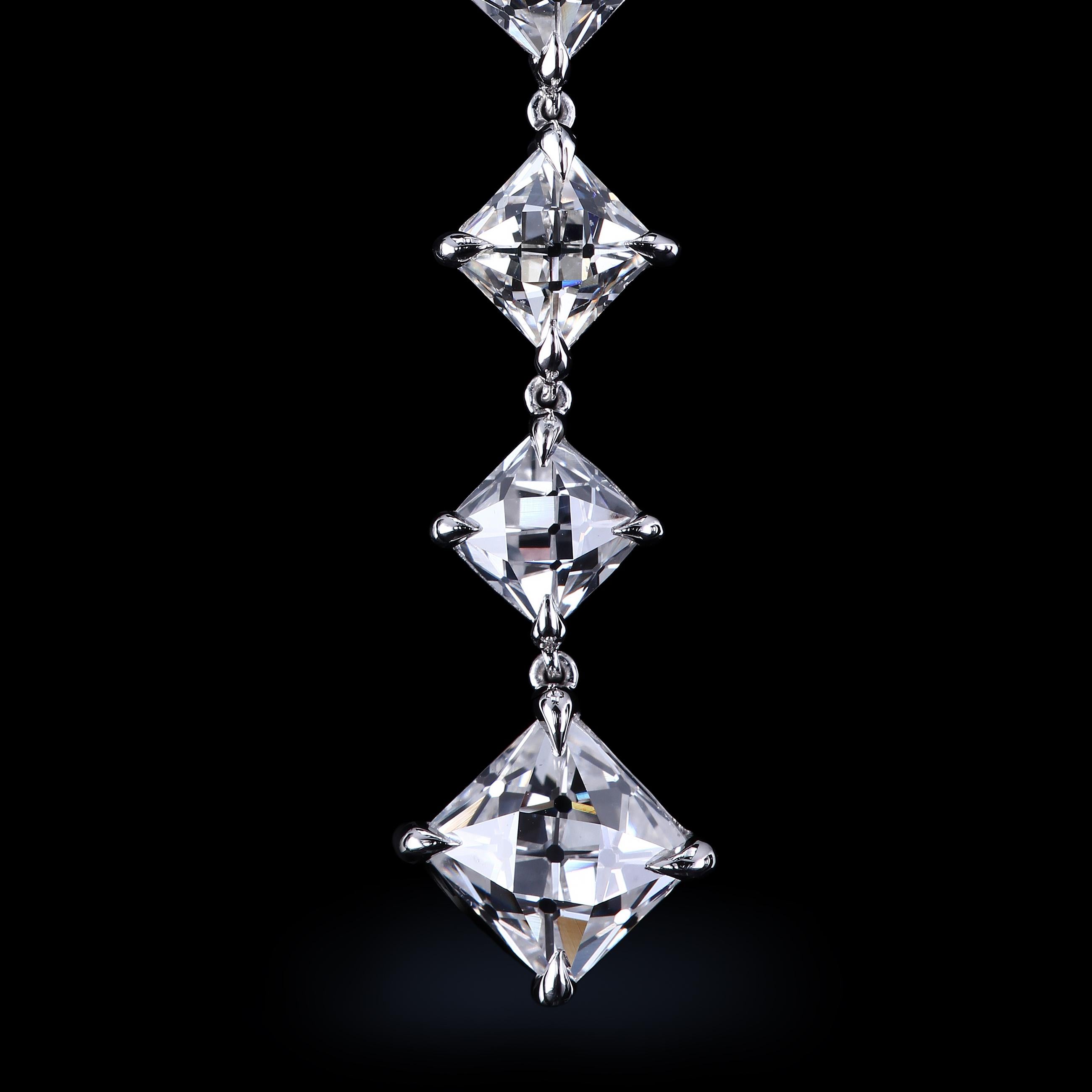Long open-back drop earrings with True Antique French cut diamonds by Leon Megé.

12 non-certified diamonds total of 9.18 carats H-I/VS2-SI1

Two largest stones being 1.64 ct H/VS2 and 1.63 ct I/SI1 ct respectfully. 

Bespoke platinum wire-work.