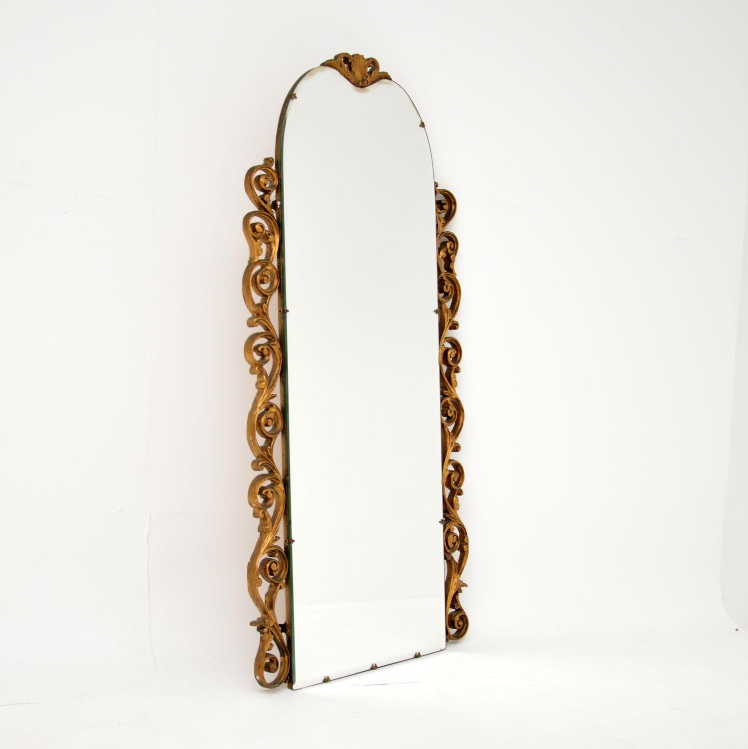 A stunning antique French decorative mirror, dating from around the 1930s.

It is beautifully made from wood and gesso, with a gorgeous gilt finish. This is a lovely slim size, practical for use in various settings around the home.

The