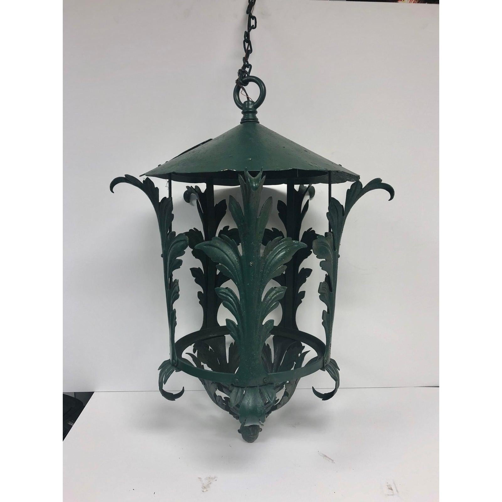 Beautiful French decorative metal lantern. We have 2 available. New wiring. It holds one reg. size bulb. Fixture H 32”, chain 34” l.