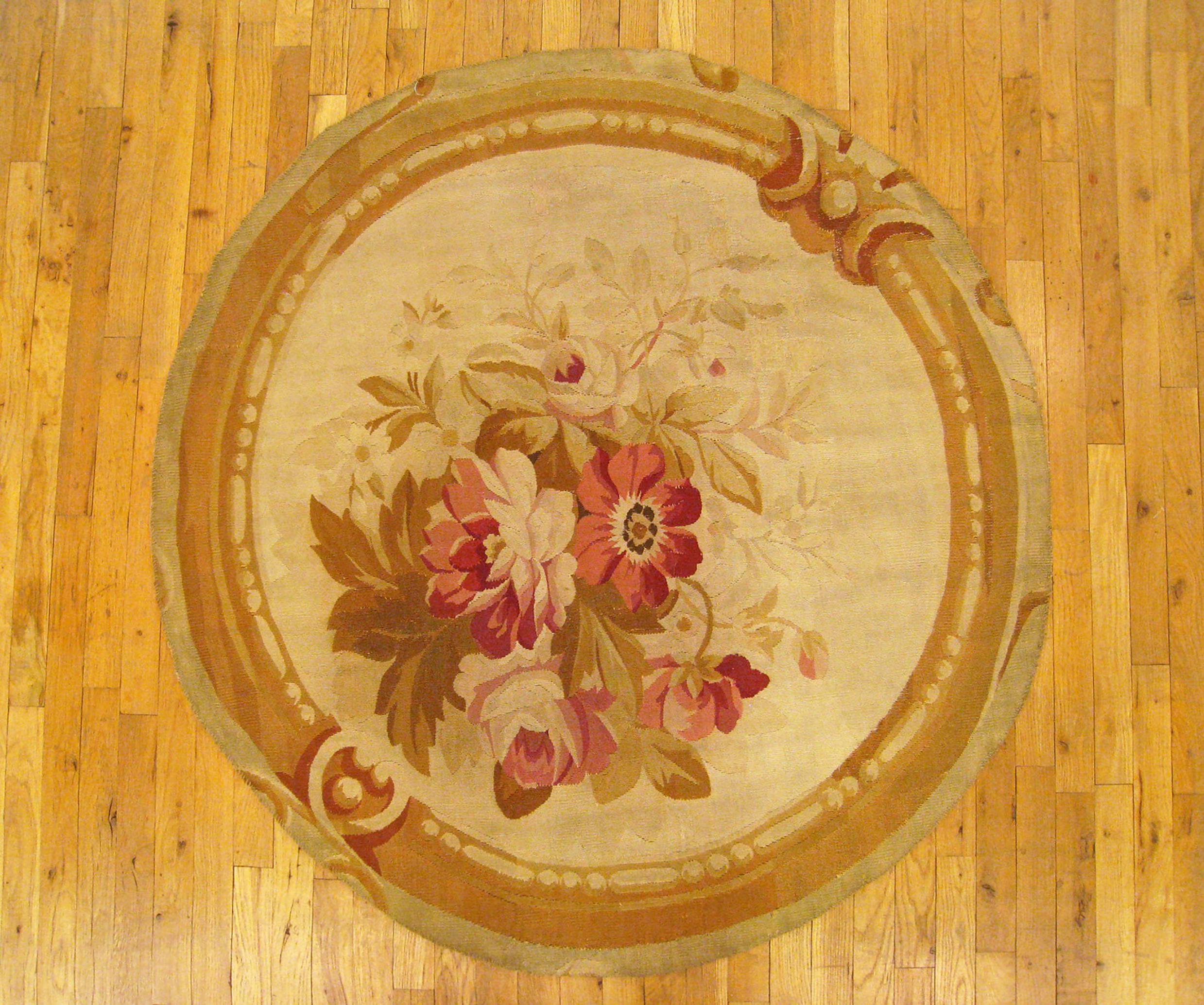 Antique French Aubusson rug, small size, circa 1890.

A one-of-a-kind antique French Aubusson Carpet, hand-knotted with soft wool pile. Featuring floral elements on the open ivory primary field, with a delicate brown outer border. In small size,
