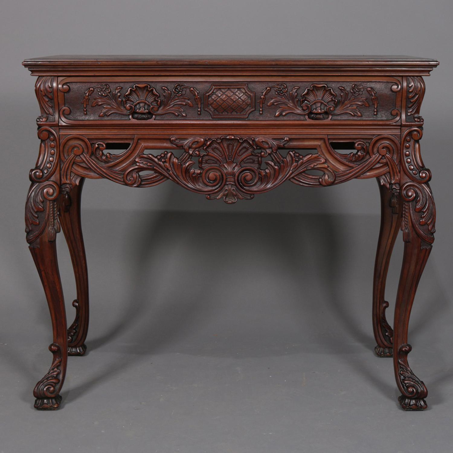 Antique French petite server features walnut construction with single frieze drawer having carved shell and foliate decoration and over pierced apron having shell with flanking scroll and foliate carving, raised on cabriole legs with acanthus knees