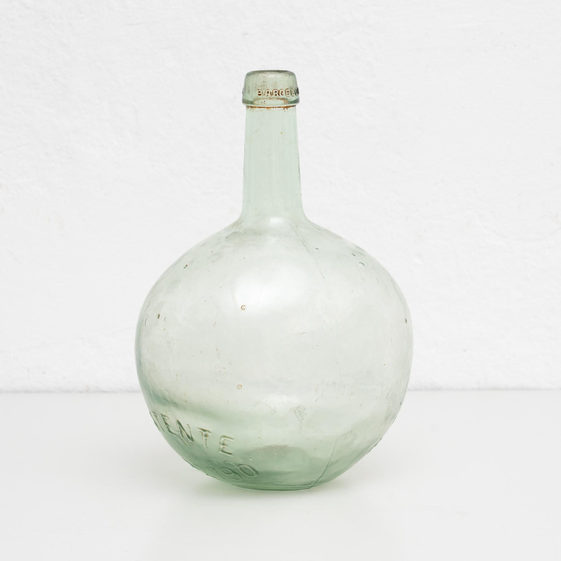 Antique Demijohn glass bottle from Barcelona.
Made in glass.

In original condition with minor wear consistent of age and use, preserving a beautiful patina.
