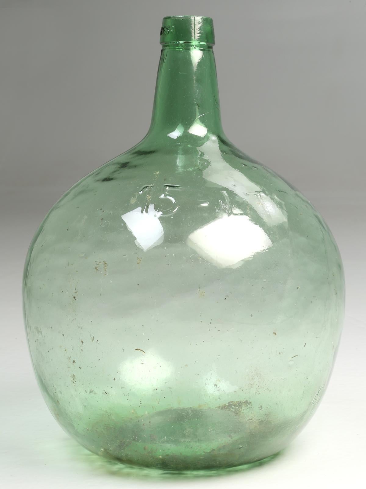 The Demijohn or Carboy, also spelled Carbouy originally referred to a large glass vessel with a small neck, encased in wicker. The word Demijohn comes from the French dame-jeanne, (Lady Jane), first used in France during the 17th century. Others