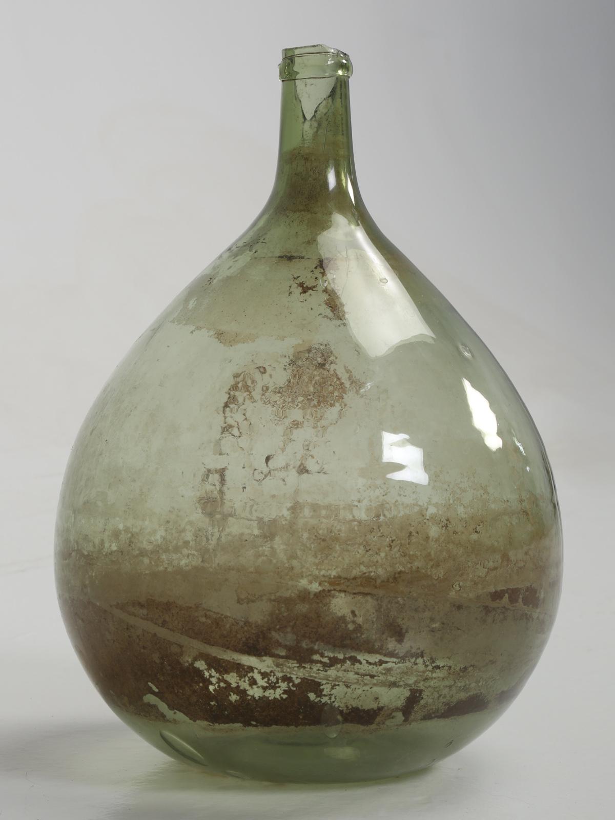 Antique French demijohn, but please note, that there is a missing piece of glass at the very top, but only on one side, so the demijohn can still be used for decorative purposes.