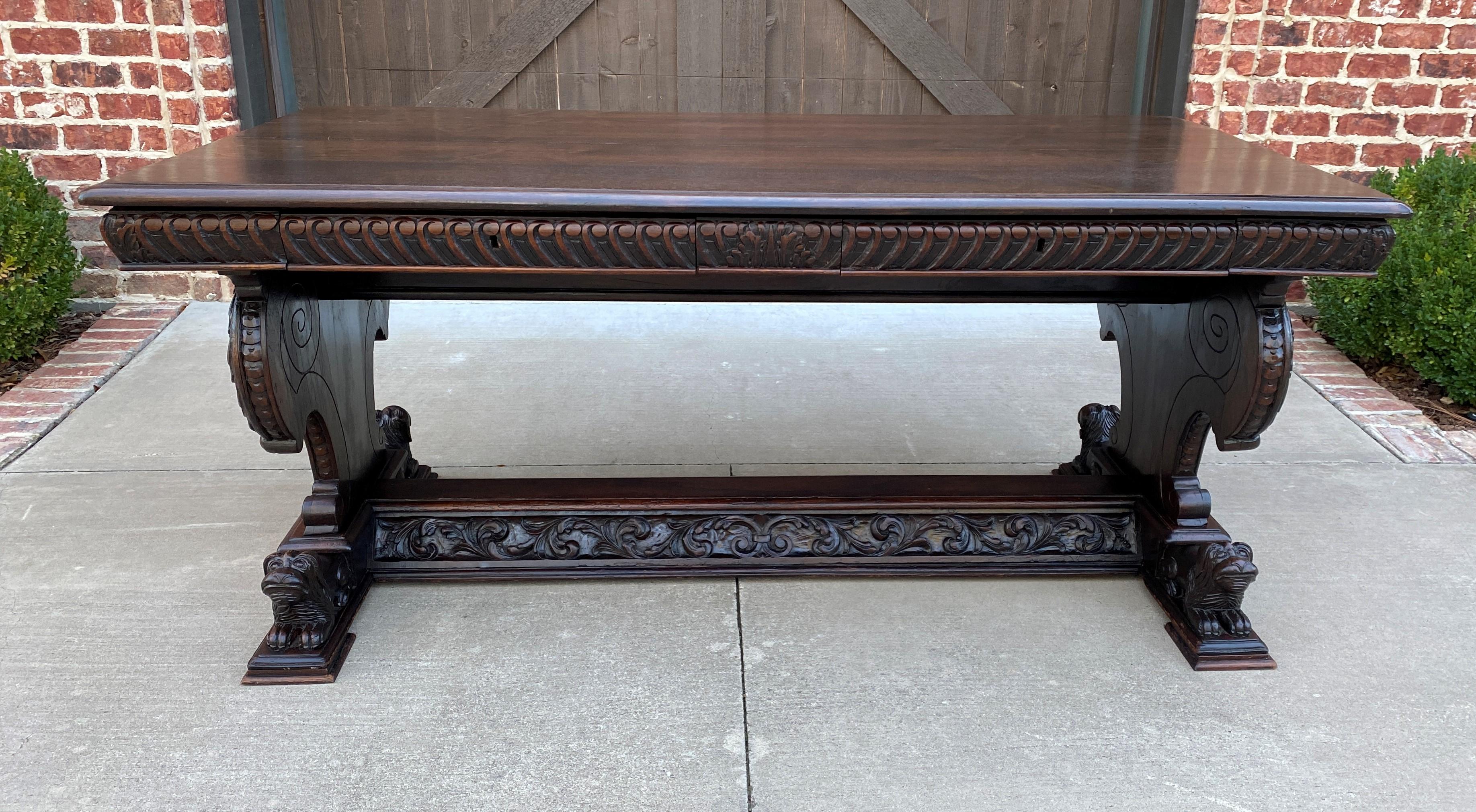 Exquisite antique French oak renaissance revival desk, library or conference table, or dining table~~c. 1860s 

This versatile executive desk or table makes quite the statement~~Highly carved French flourish accents on all four sides resting on
