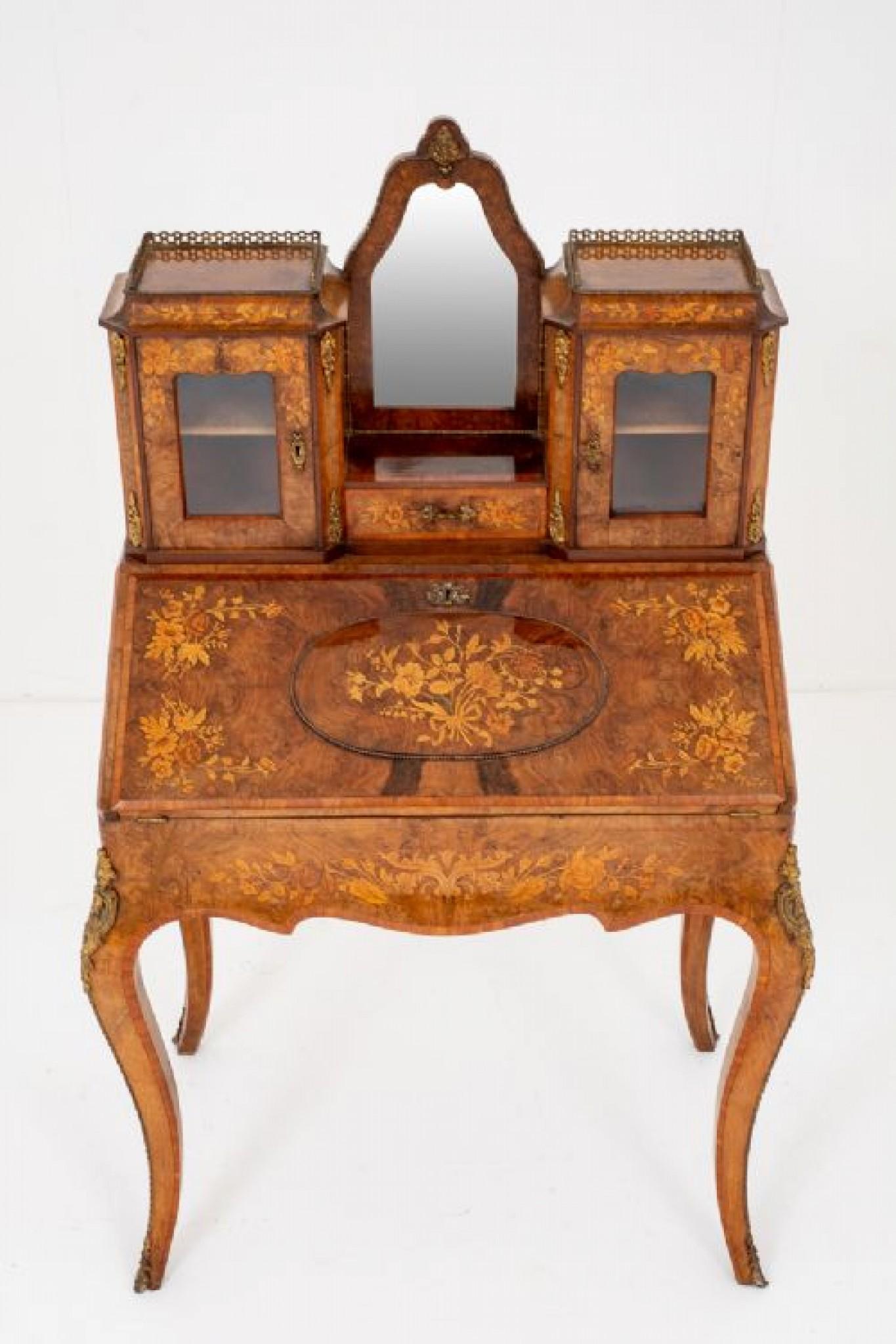 Wonderful French Walnut and Marquetry Bonheur de Jour.
Standing on Typical French Swept Legs with Ormolu Mounts and Kingwood Cross banding.
The Fall having a raised tablet with beautiful floral inlays.
circa 1860
The upper section featuring a