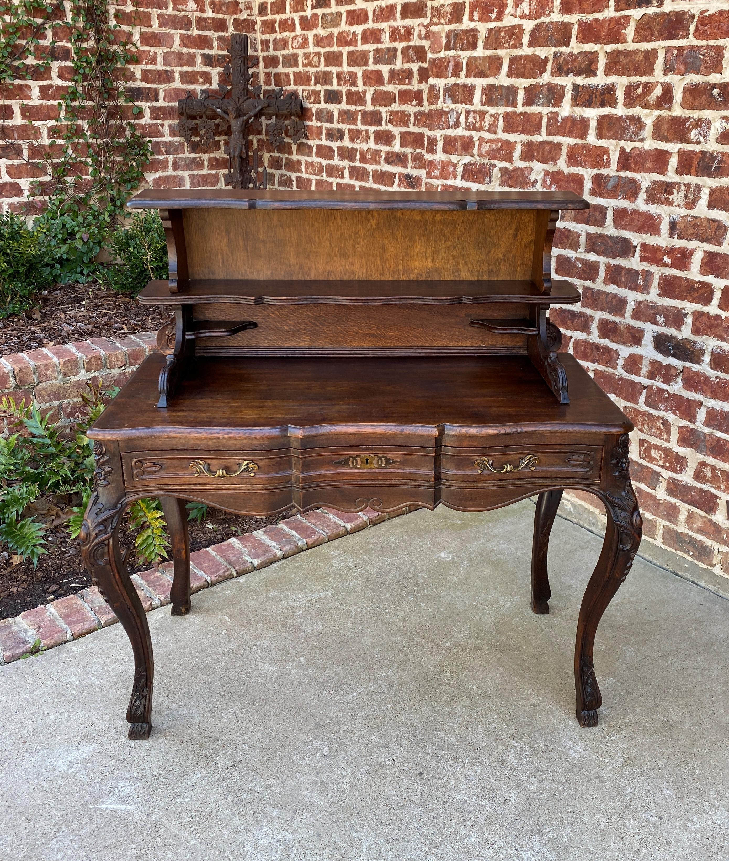 Superb 19th century Antique French Oak Louis XV style open shelf desk or writing table with drawer.
 

This is a beautiful French oak desk or writing table with one full length drawer~~beautifully carved cabriole legs with carved knees and 