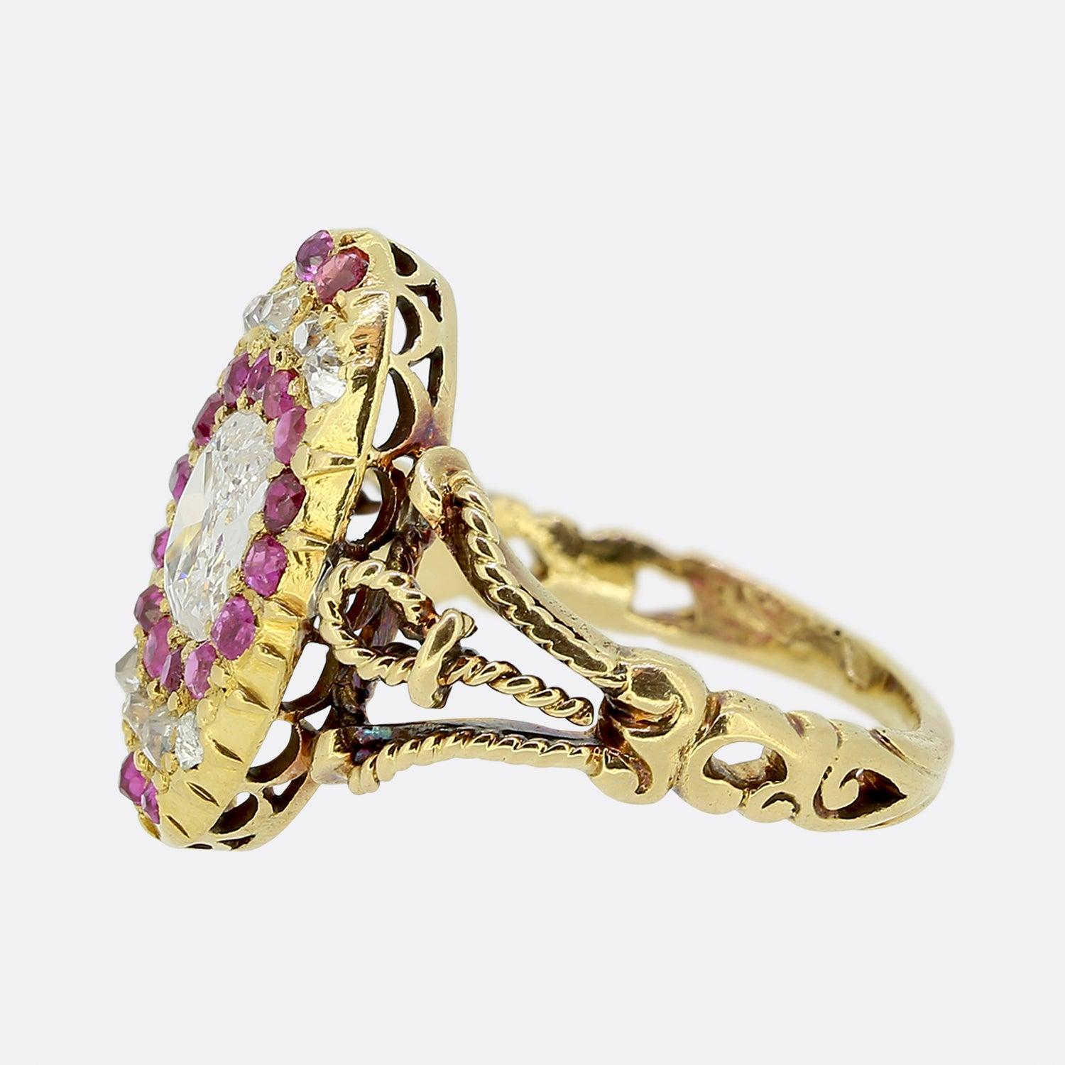 This is a wonderful diamond and ruby ring dating back to the late 1800s. The ring is in the highly decorative French Second Empire style which emerged under Napoleon III and lasted roughly from 1850s-1890s. The focal point of the ring is a cushion