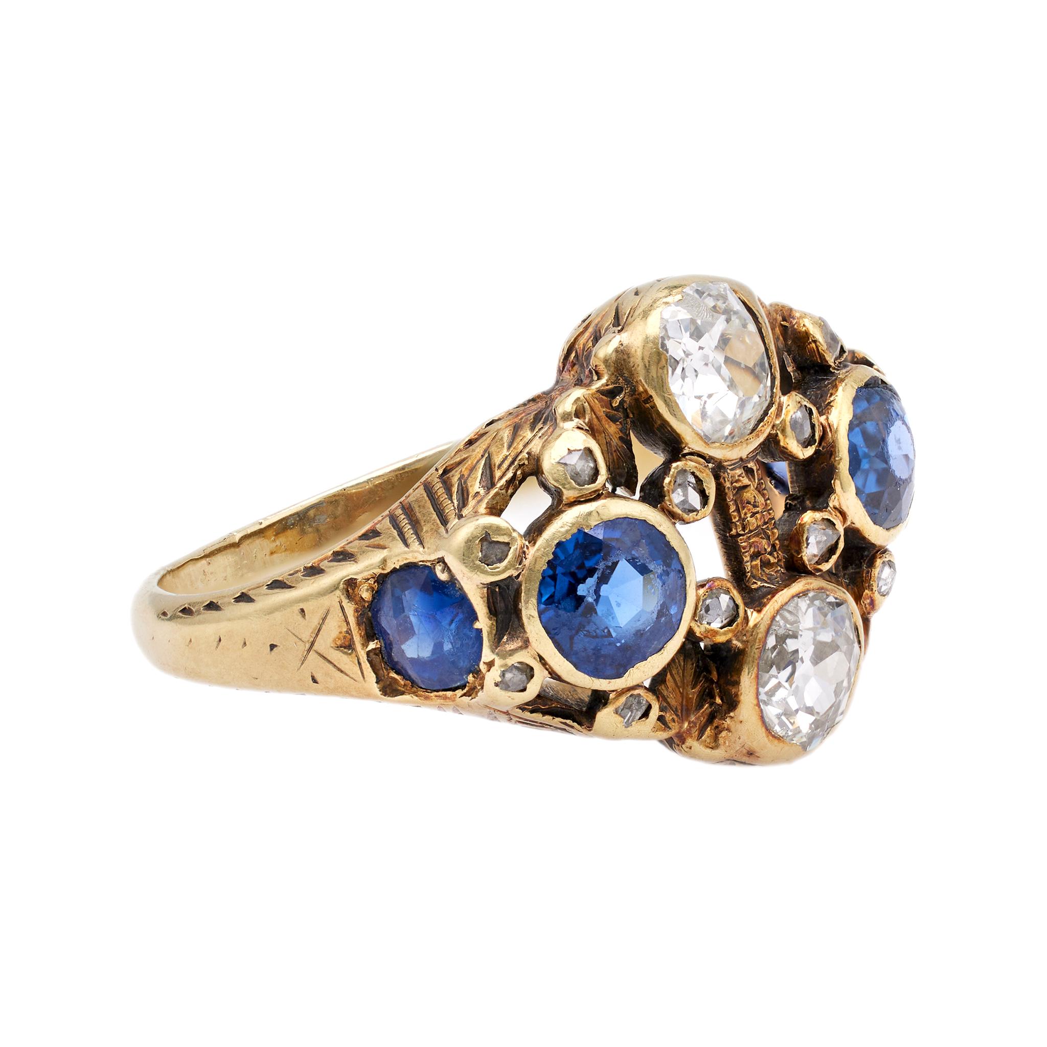 One Antique French Diamond and Synthetic Sapphire 14k Yellow Gold Ring. Featuring two old mine cut diamonds with a total weight of approximately 0.70 carat, graded H-I color, I1 clarity, and four cushion mixed cut synthetic sapphires with a total