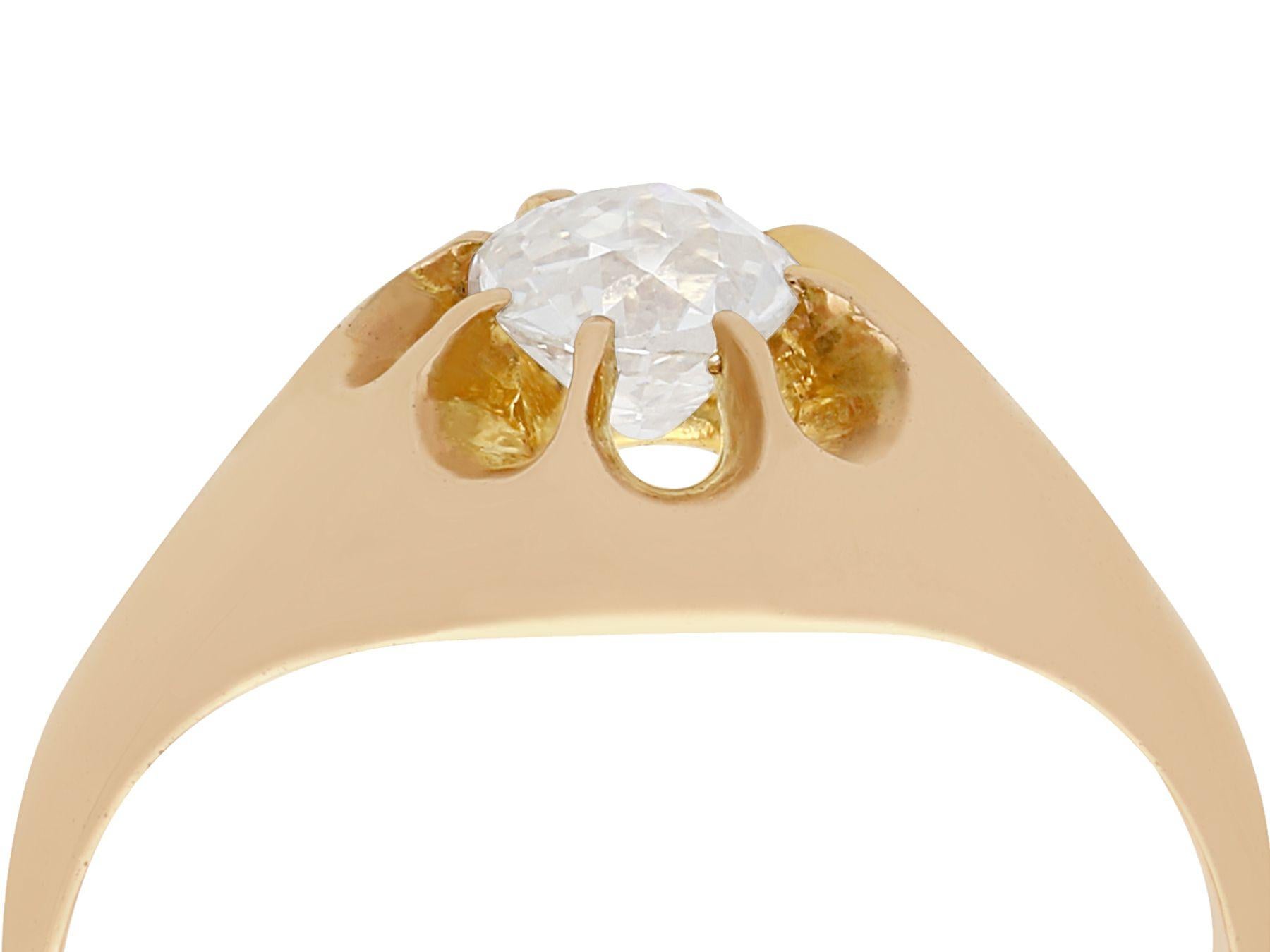 A stunning, fine and impressive antique French 0.64 carat diamond and 12 karat yellow gold gent's dress ring; part of our diverse antique jewelry and estate jewelry collections.

This stunning, fine and impressive gent's antique diamond ring has