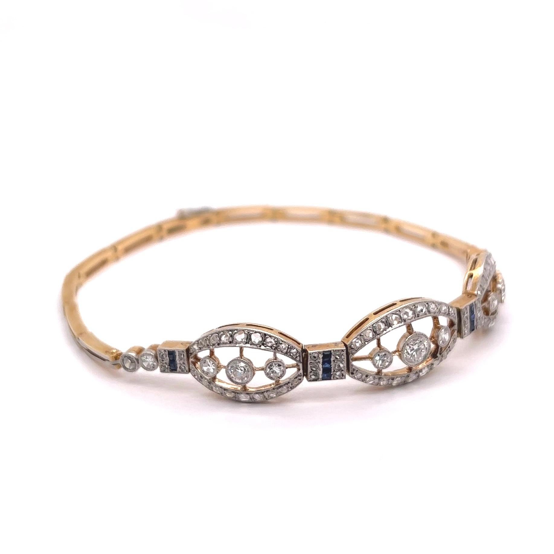 One Antique French Diamond Sapphire 18 Karat Yellow Gold Platinum Bracelet. Featuring three old European cut diamonds with a total weight of approximately 0.35 carat, and ten single cut diamonds with a total weight of approximately 0.50 carat,