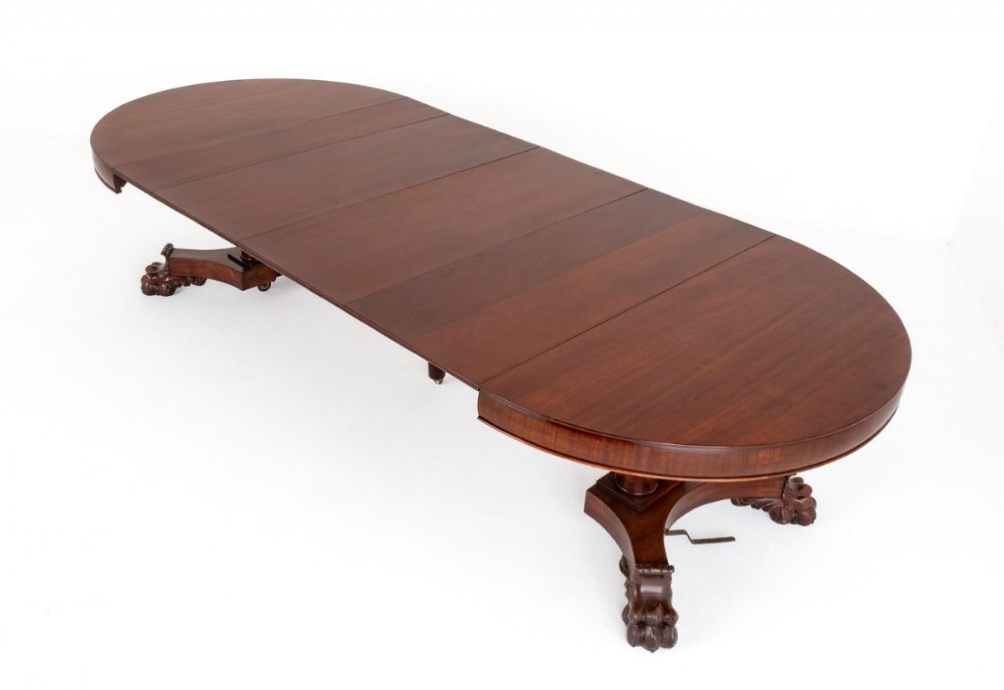 French Mahogany Extending Dining Table.
This Impressive Dining Table is Raised Upon a Platform Base with Boldly Carved Lions Paw Feet.
Circa 1880
The Top is Supported By 4 Columns and Features an Apron.
The Table Extends By Way of a Pullout