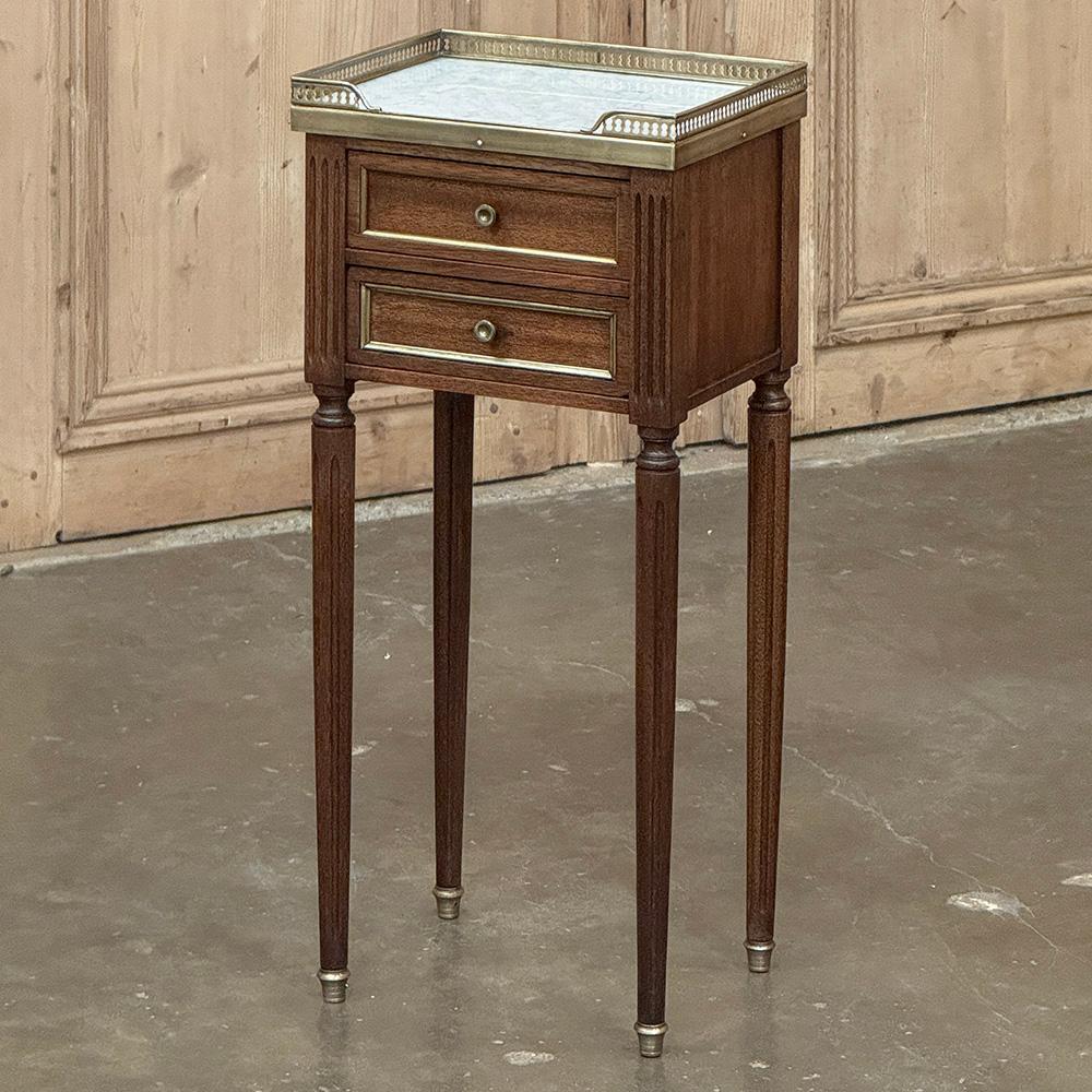 Antique French Directoire Mahogany End Table with Carrara Marble will make a great accent for any room.  Its diminutive size makes it ideal for cozy dwellings or seating groups.  Finished on all four sides, it can even be placed in the central areas