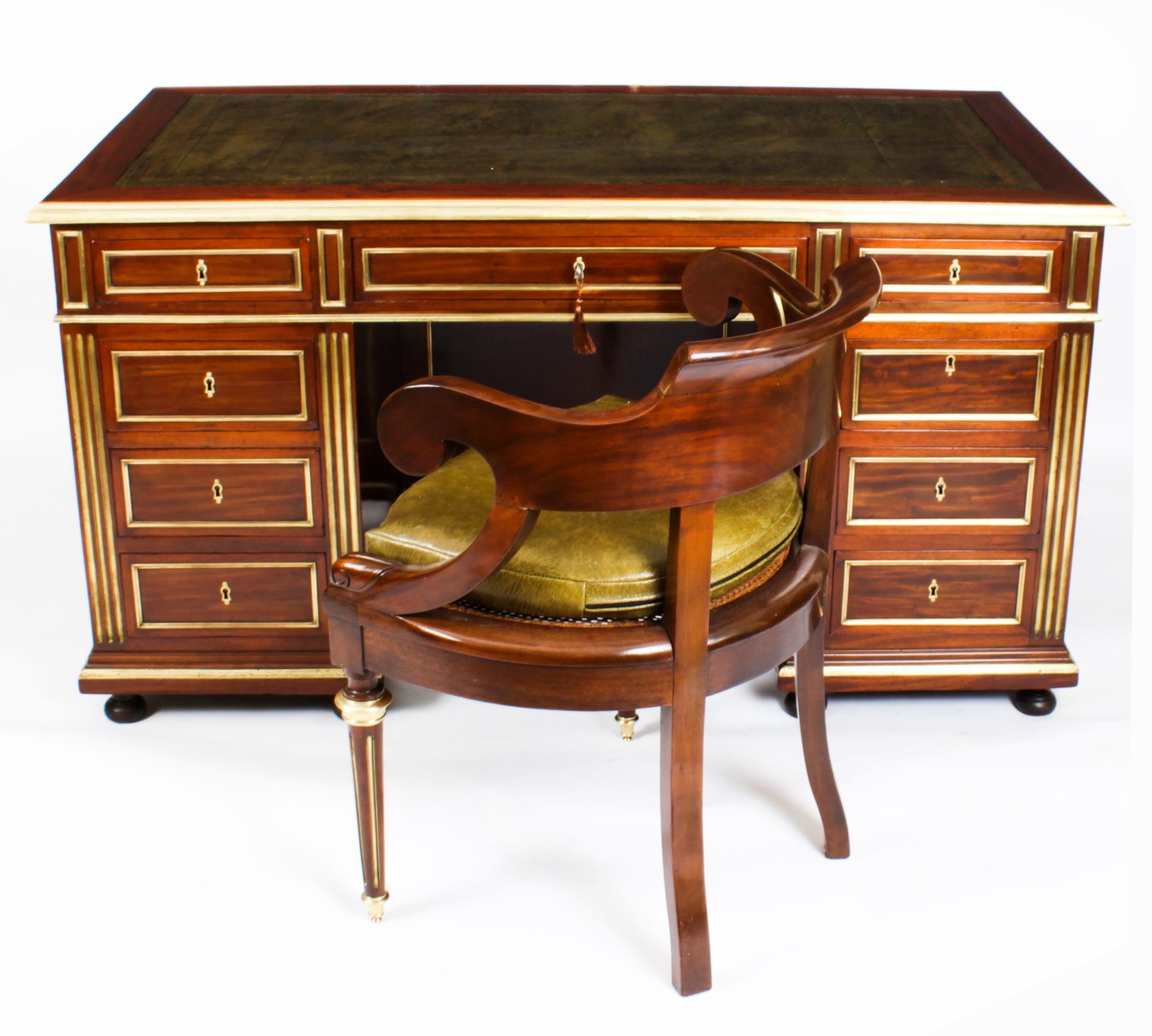 A superb French Directoire Ormolu mounted pedestal desk & armchair set, Circa 1850 in date.
 
The desk has a rectangular top with an inset gilt-tooled green leather writing surface and trimmed with ormolu borders above three frieze drawers and a