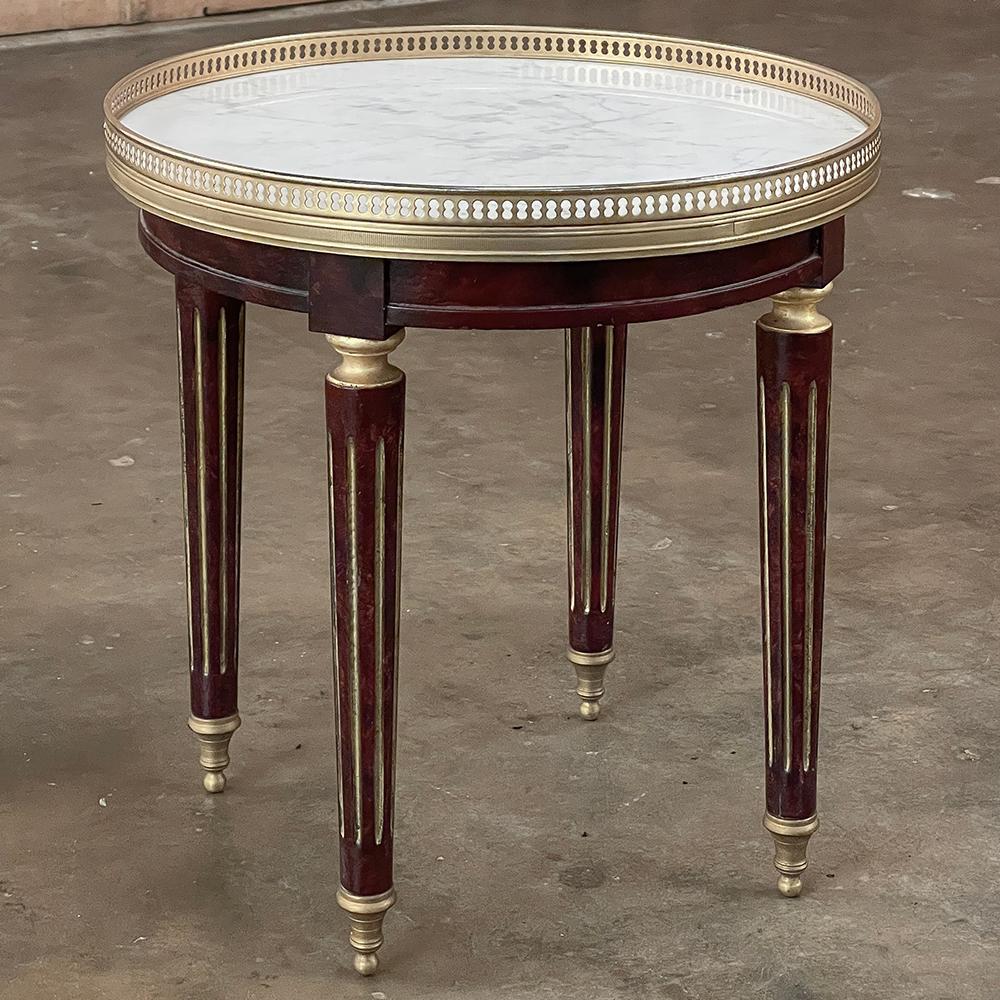 Antique French Directoire Style Bouillotte Side Table with carrara Marble is perfect for a cozy seating group with a carefree yet elegant marble top that allows one to place cold drinks or other such items that would cause problems with all-wooden