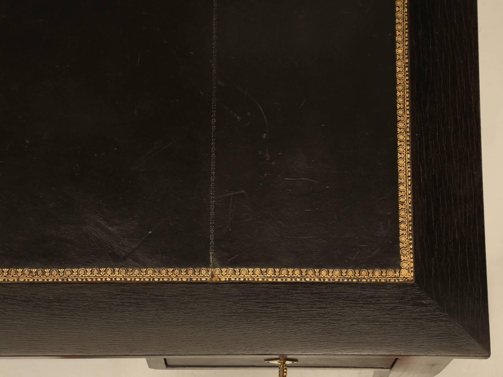 Late 19th Century Antique French Directoire Style Desk in an Ebonized Finish and Restored Leather