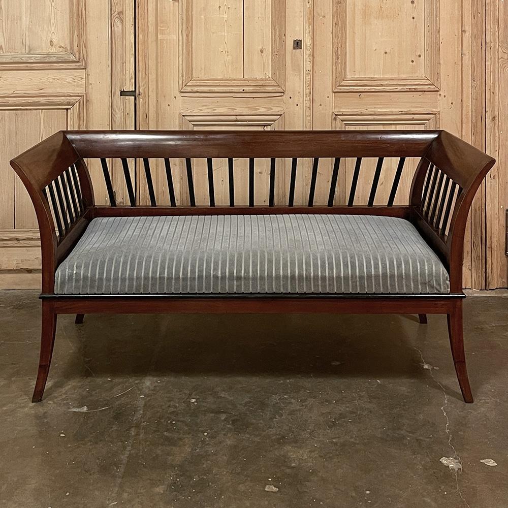 Antique French Directoire style Settee ~ Canape is ideal for a light and airy look, with a minimal footprint for more cozy seating arrangements. The rich coloration of the solid sycamore framework is offset by the openness of the seatback and