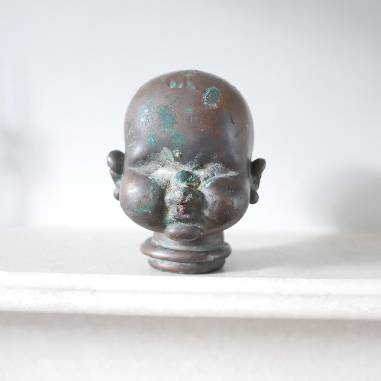 A rare antique doll mould, early 20th century. 

Patinated metal. 

The largest one we have found. 

French.