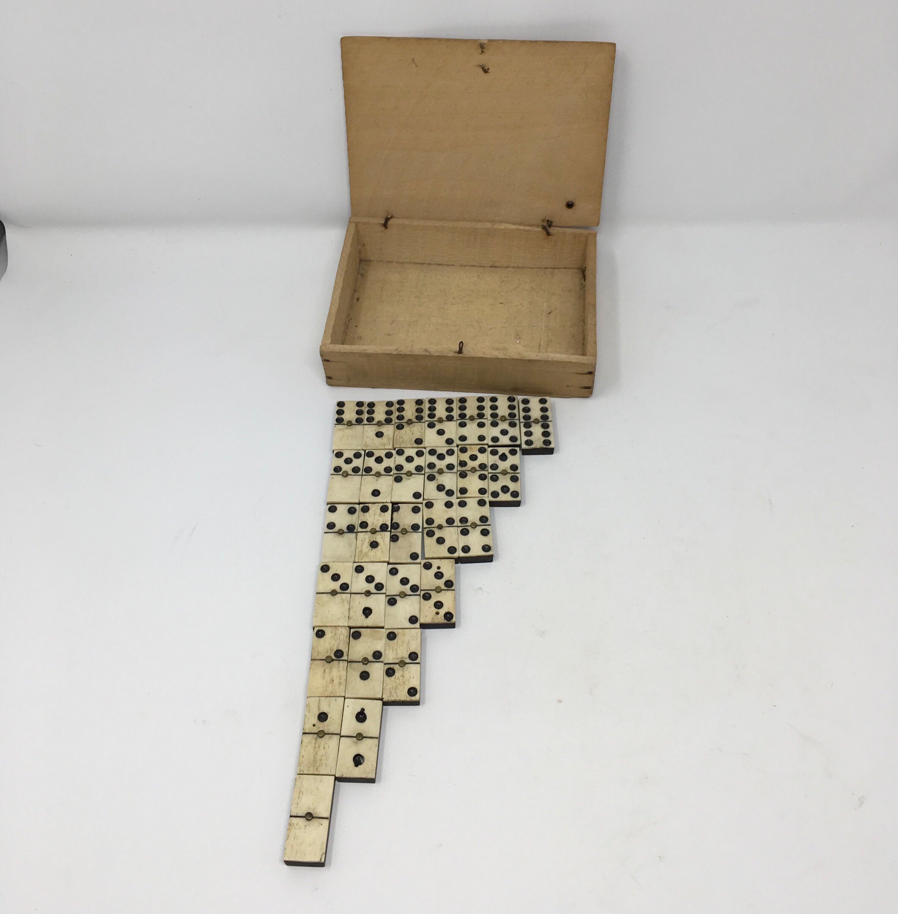 Found at a small market in Southern France, this antique domino set is sure to delight. The set of 28 dominos are presented as found in an old wood box measuring: 6.25
