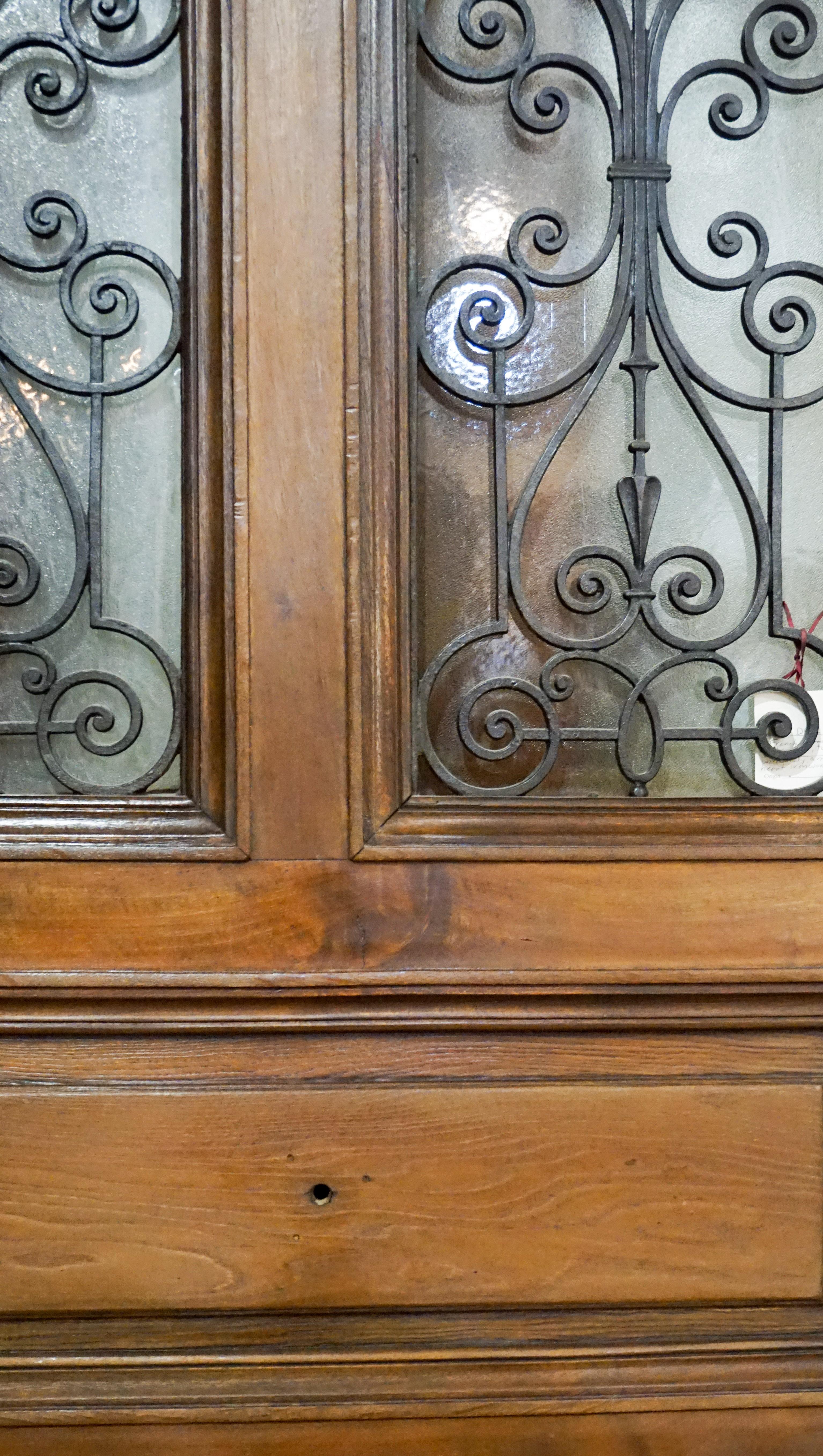 French oak entry door with twin windows, arrow and heart iron work design details. 

Origin: France, circa 1860.

Measurements: 43