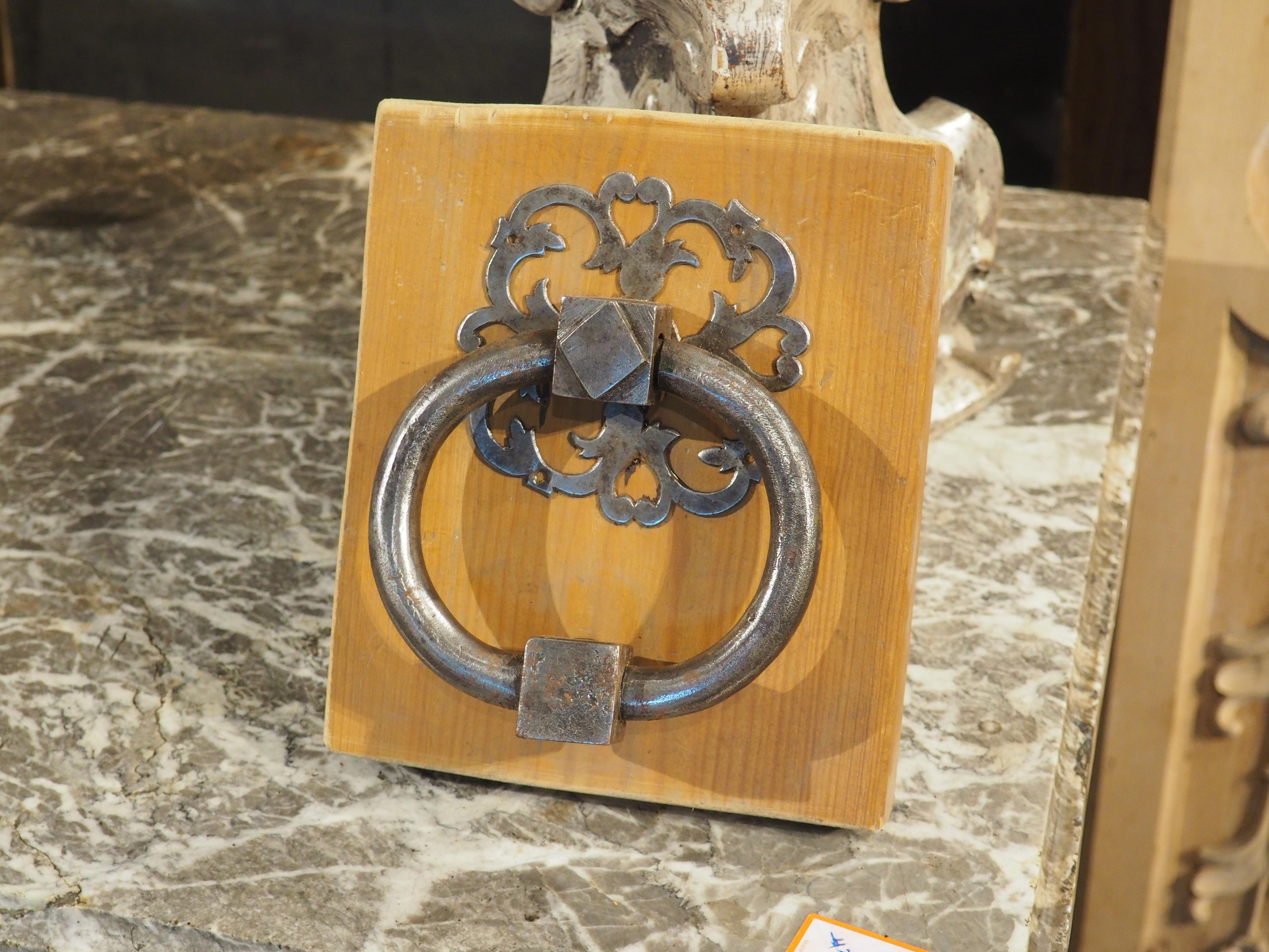 More information coming soon…

A fascinating French door knocker from the 1800s, with a thick oval handle adorned with two square joineries, one embellished with a raised lozenge.  The robustness of the handle is offset by a thin pierced backplate,