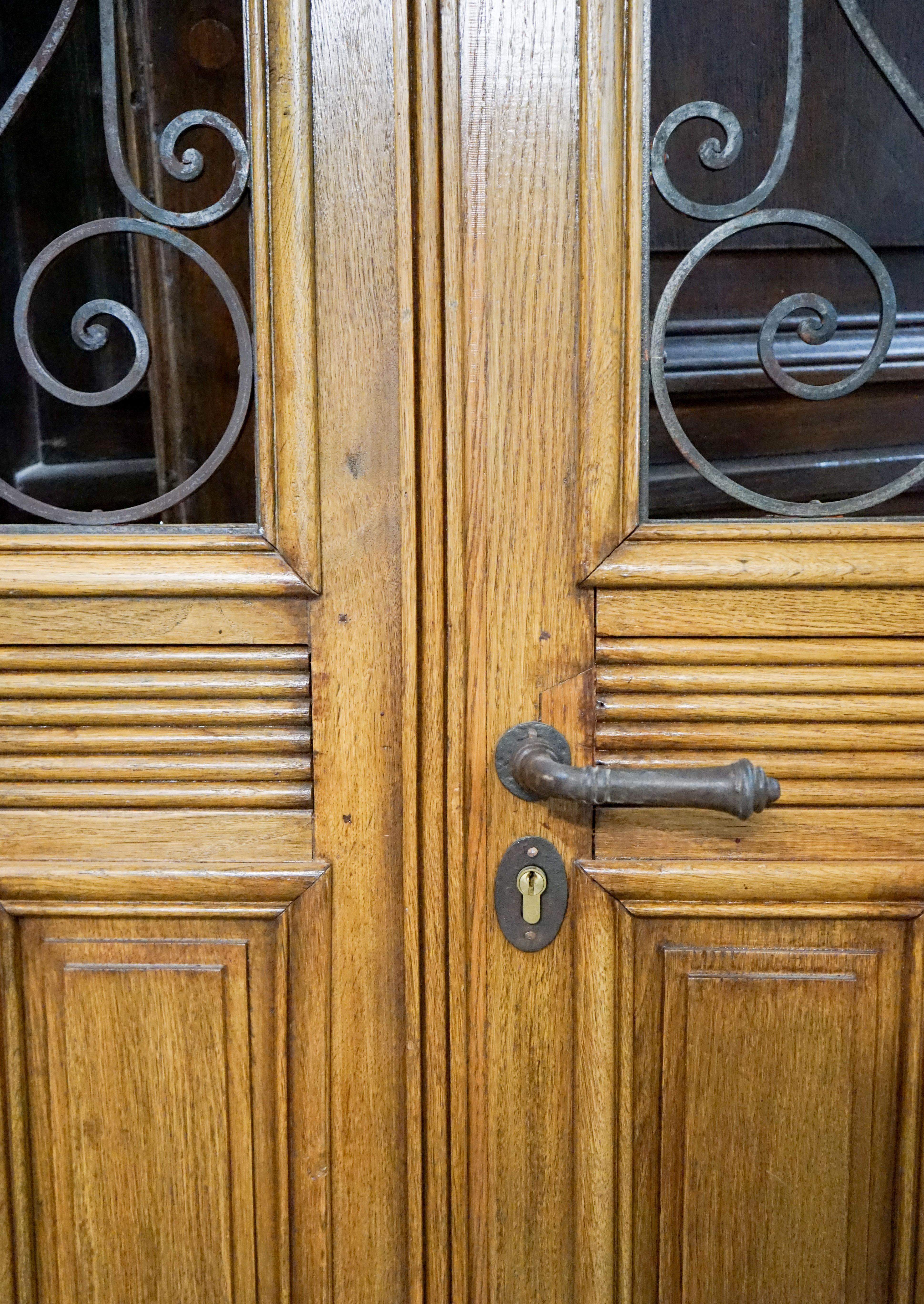 Antique double door from the Bordeaux region of France, circa 1890, made from oak with iron work windows. Ready for install with keys.