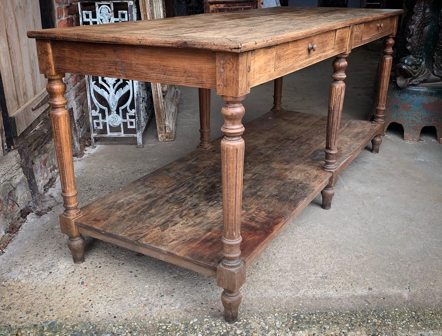 A beautiful antique French drapers table which would make a lovely kitchen island. The wood has a nice patina with age related wear giving it a great look.

This was a drapers work table for many years so as you would expect it does have marks and