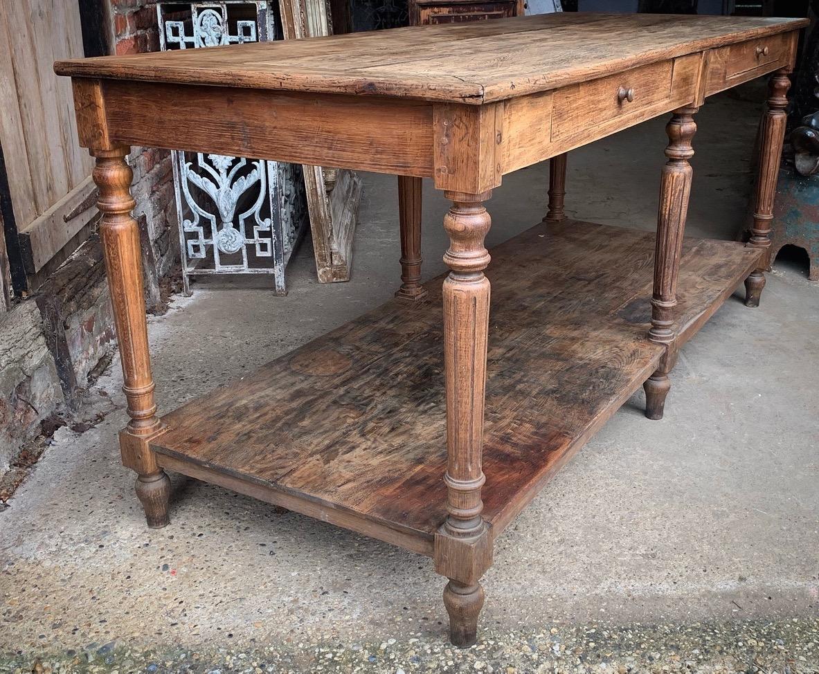 A beautiful antique French drapers table which would make a lovely kitchen island. The wood has a nice patina with age related wear giving it a great look.

This was a drapers work table for many years so as you would expect it does have marks and