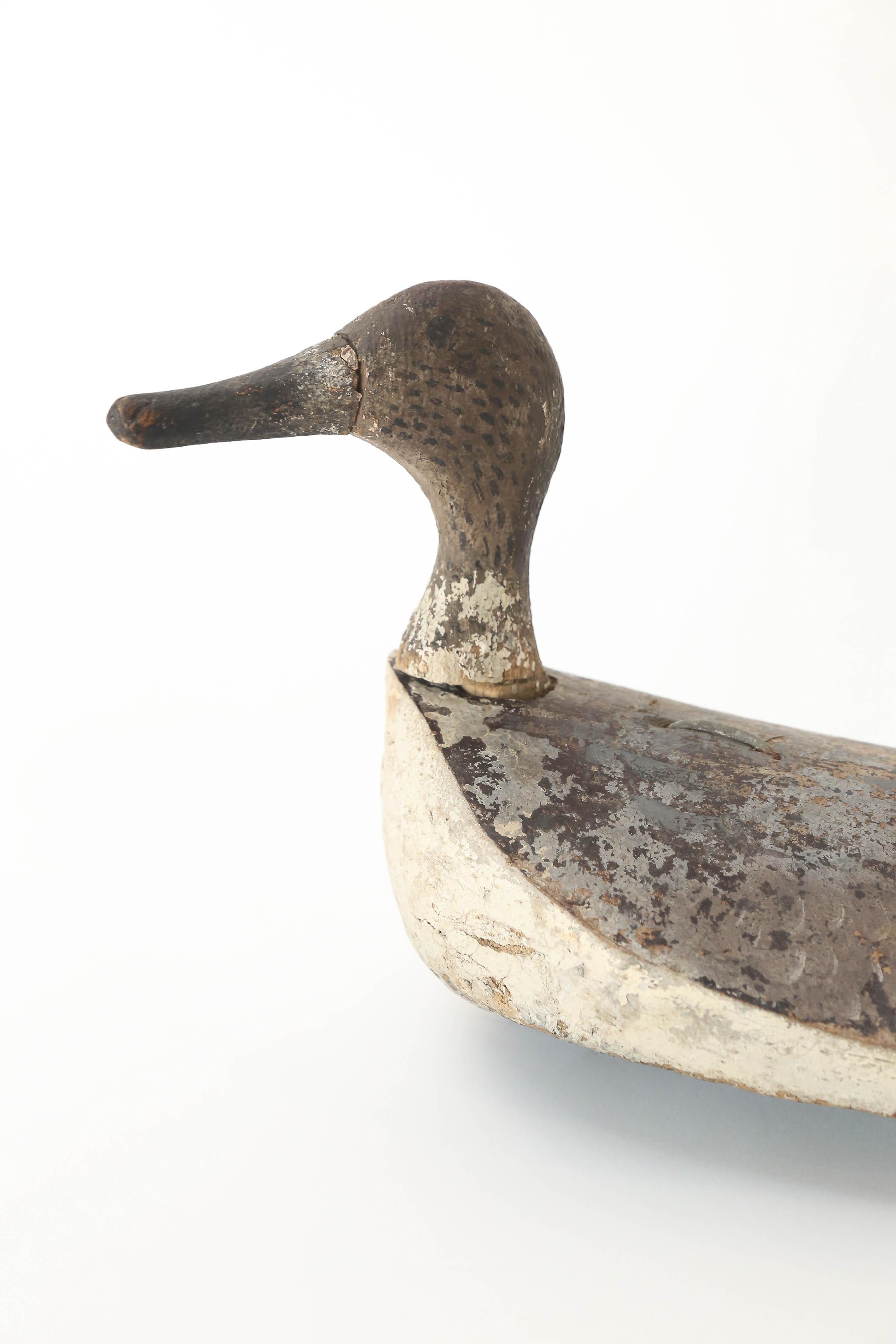 A hand-carved and painted wood duck decoy found in France. A wonderful addition for the collector.