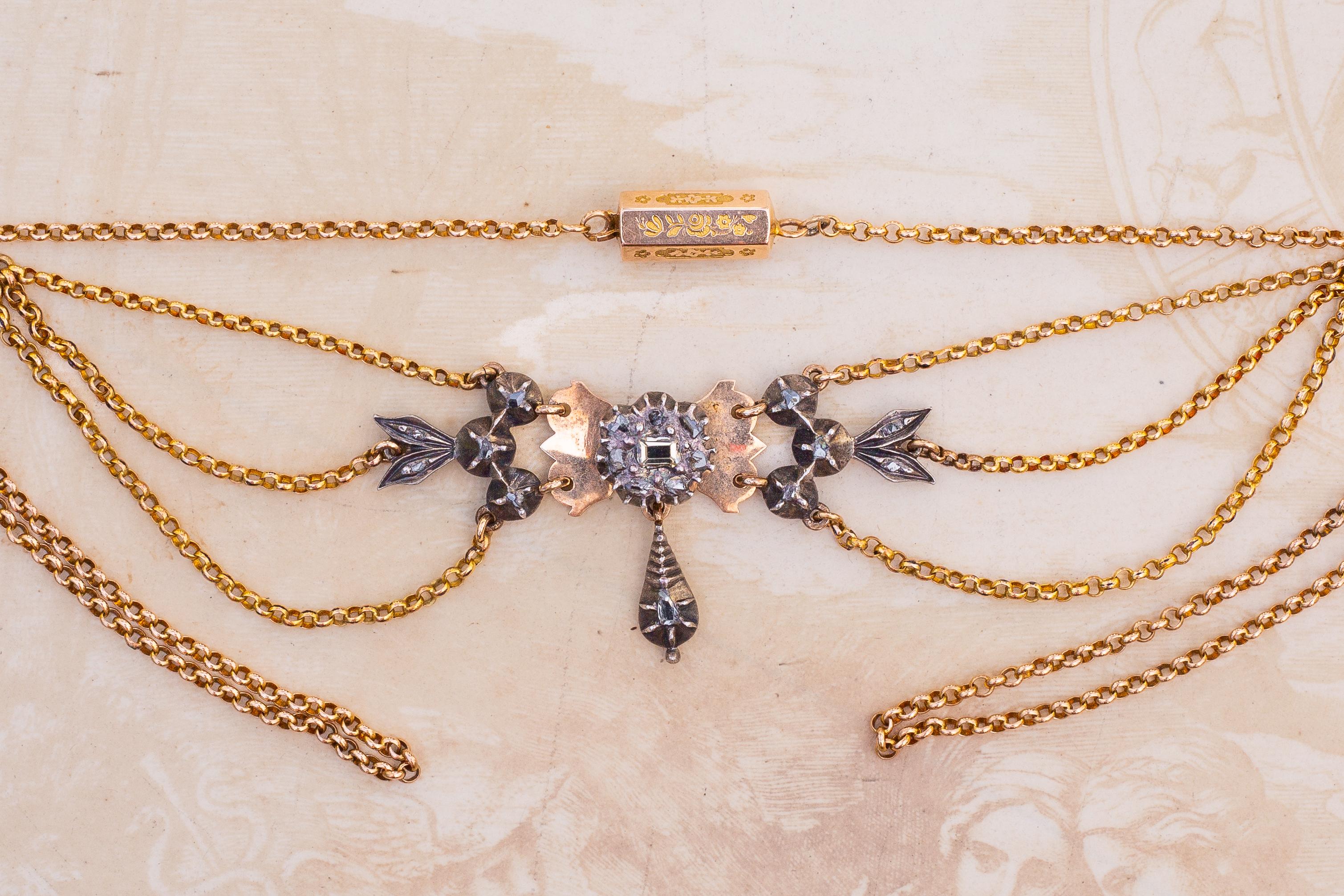 A fantastic French antique 18K gold and silver drapery necklace with rose cut and table cut diamonds. This necklace is an excellent example of French provincial craftsmanship from the region of Arles, Provence and dates to the early 19th
