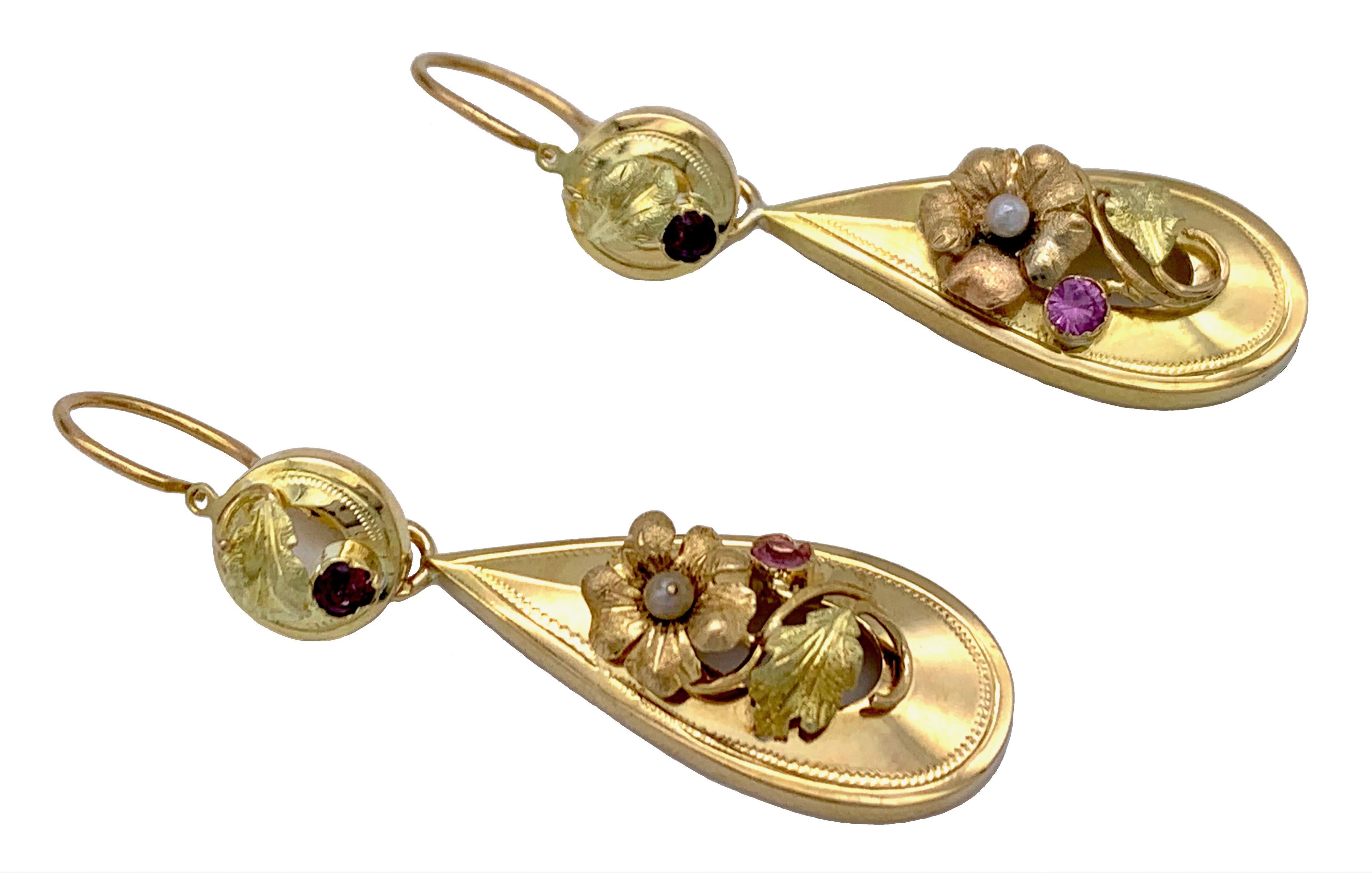 These earrings are called day and night earrings because the tops can be worn by them selves.
The earrings have been executed in three different gold hues and embellished with fine engraving. 