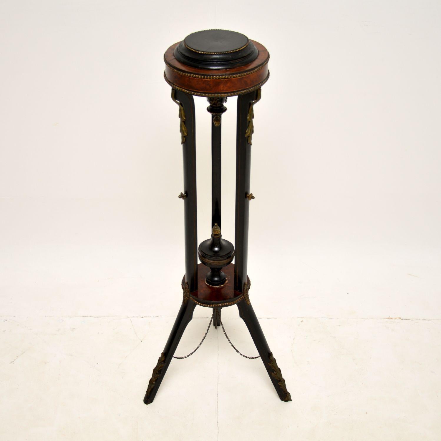 A beautifully designed antique jardiniere / torchere stand in walnut, amboyna and ebonised wood. This was made in France, it dates from around the 1860-1880 period.

It is of excellent quality, and is perfect for use as a plant stand or an object
