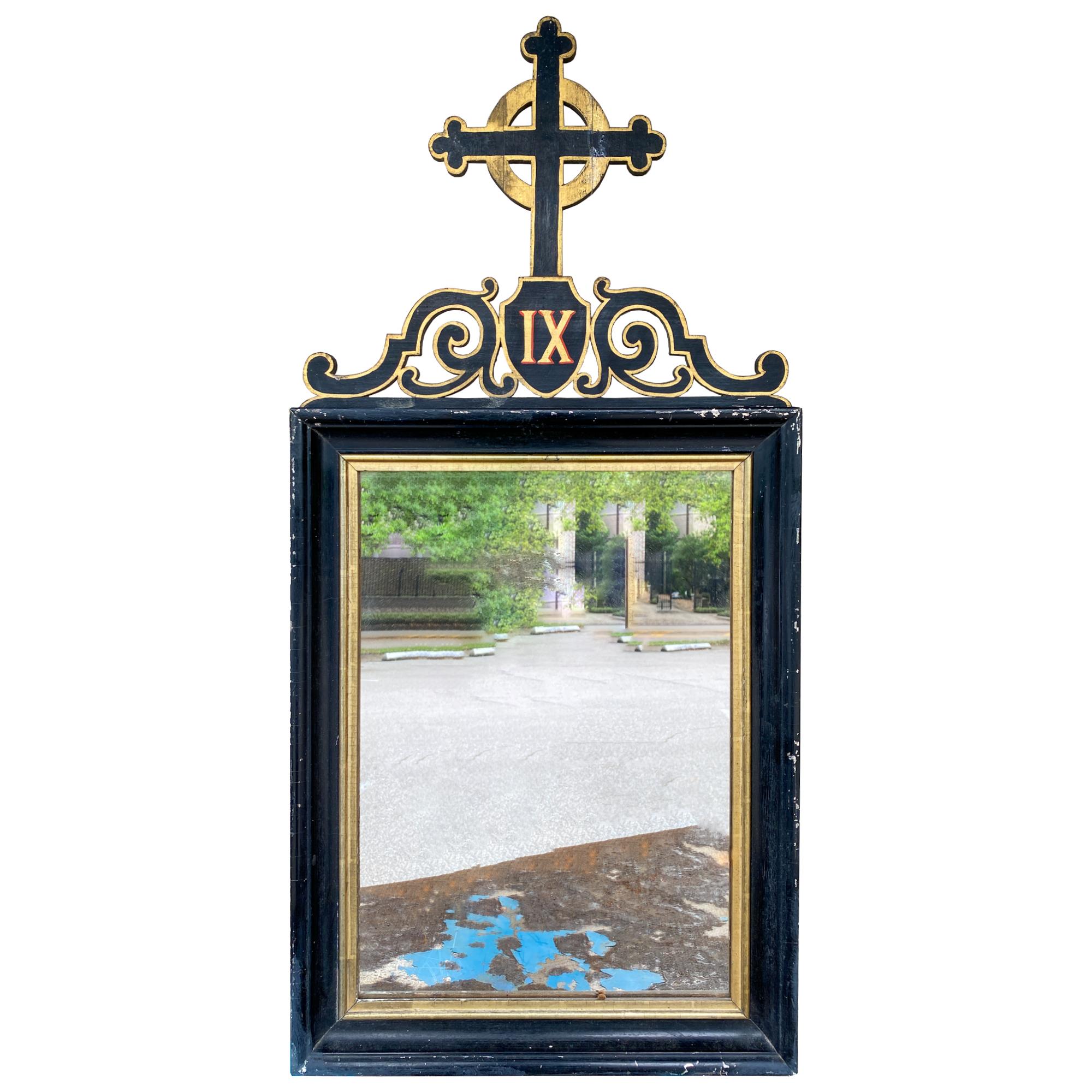 A very special pairing of antique French ebonized and giltwood stations of the cross framed mirrors, which likely once held artwork reflecting the stations, but have since been modified as mirrors. Each piece features a decorative open carving of a