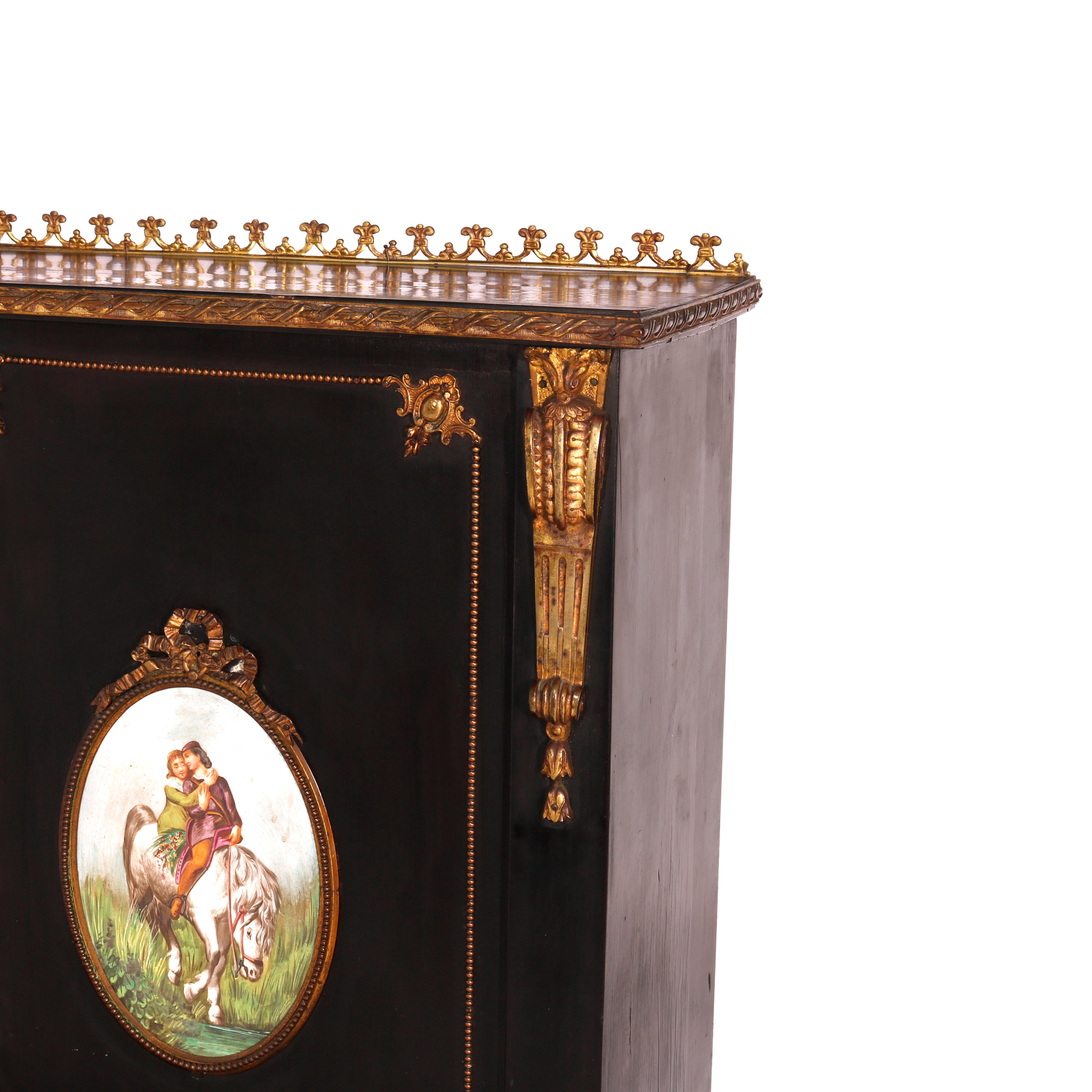 An antique French ladies desk offers ebonized finish with upper ormolu gallery over double door case having painted porcelain plaque insets and gilt decoration, fold out writing surface and raised on tapered legs, circa 1890

Measures - 52.5