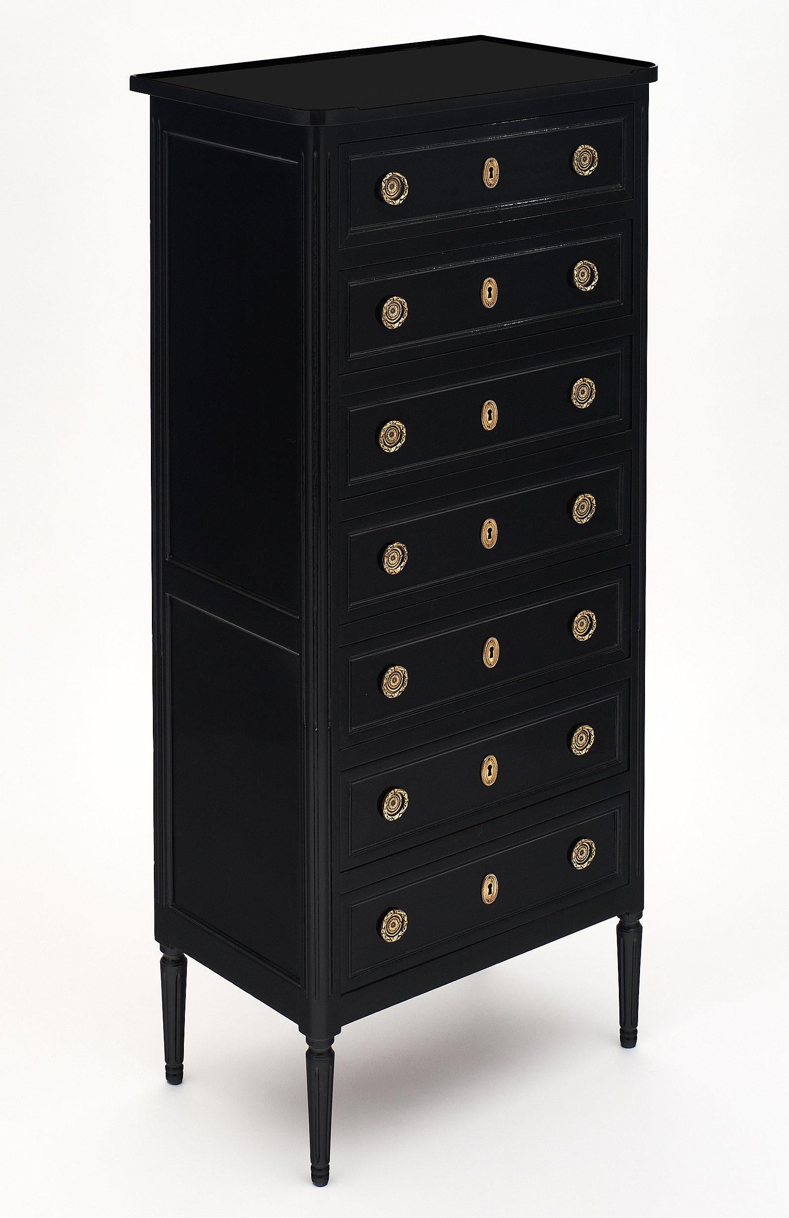 A French ebonized antique semainier. This classic, nicely built “semainier” (semaine is week in French, one drawer per day of the week) is made of mahogany with finely cast and original gilt bronze hardware. The mahogany has been ebonized and