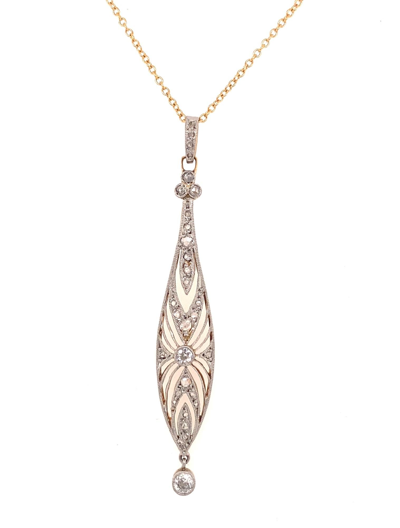 This is a beautiful original Edwardian pendant with French hallmarks c.1910-1920.  The pendant has an intricate filigree design with rose cut and old mine cut diamonds. The front is platinum the back is 18k yellow gold. There are 27 rose cut