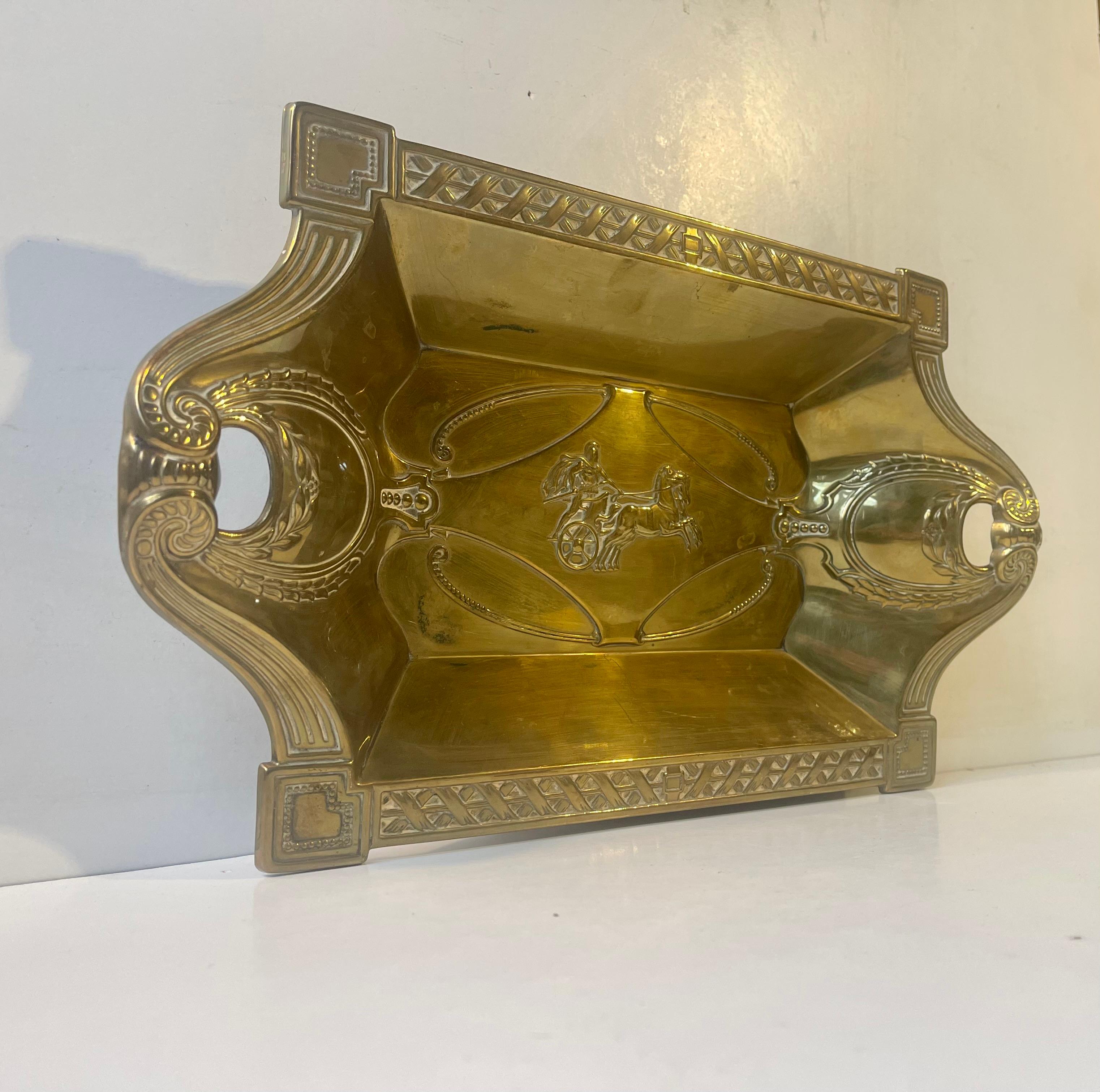 Embossed Basket in Brass suitable for bread, fruits or vanity purposes. Distinct art nouveau styling and a center motif or a riding gladiator. Made in France circa 1900-1920. Measurements: 35x21x5 cm.