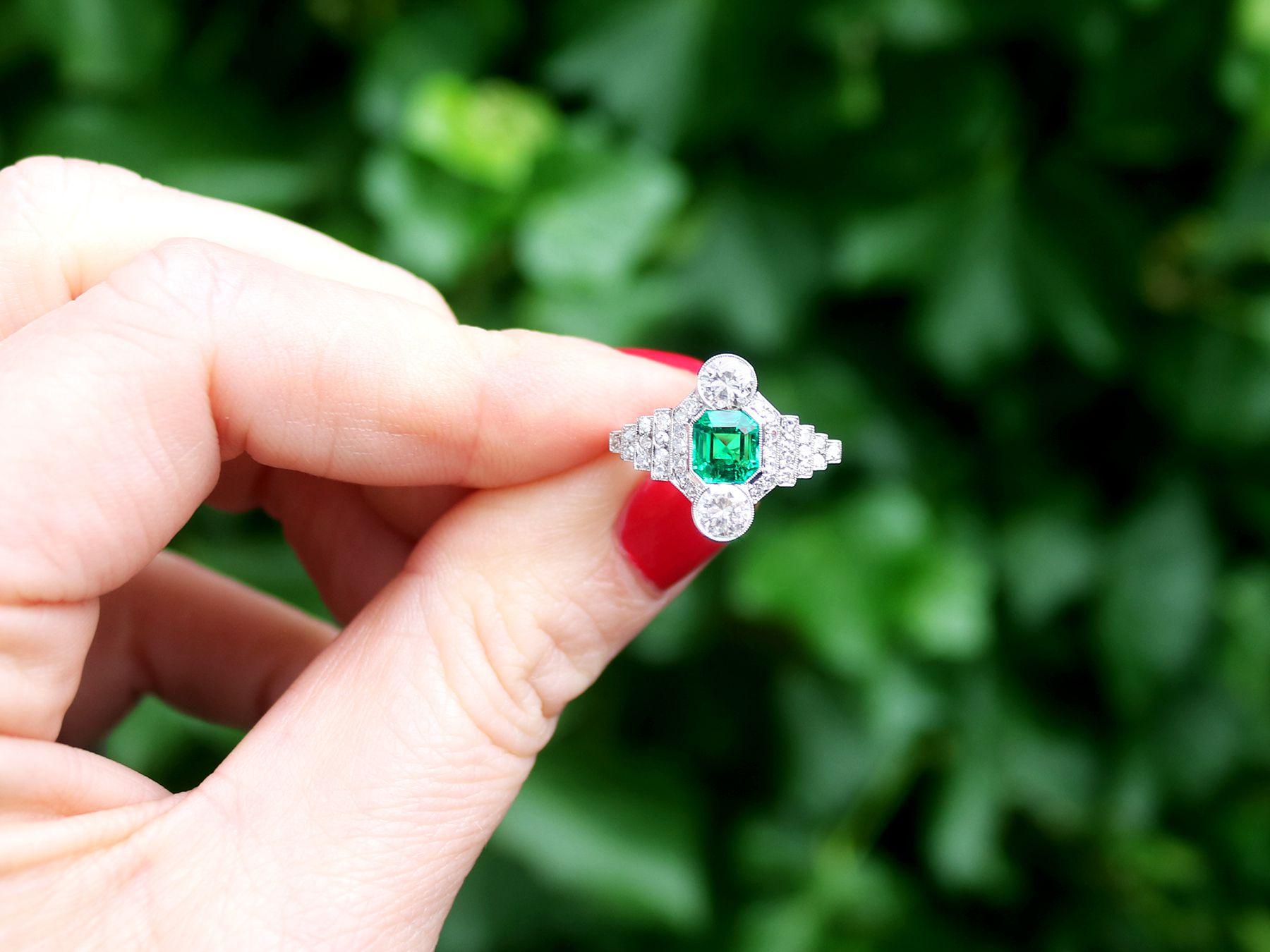 A stunning antique French 0.97 carat Colombian emerald and 1.06 carat diamond, platinum dress ring; part of our diverse antique jewelry and estate jewelry collections

This stunning, fine and impressive antique emerald and diamond ring has been