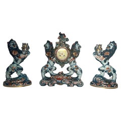 Antiquité française Émile Gallé 3 Pieces Porcelain Lion Clock Garniture Set Circa 1890
