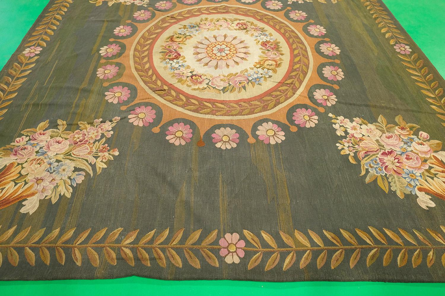 Mehraban antique French Empire Aubusson-design tapestry, made in France. The motif includes floral and medallion patterns. Item is a flat weave wool rug in green, brown, gold, and pink.


Rug Number 55008
Size 8' 6