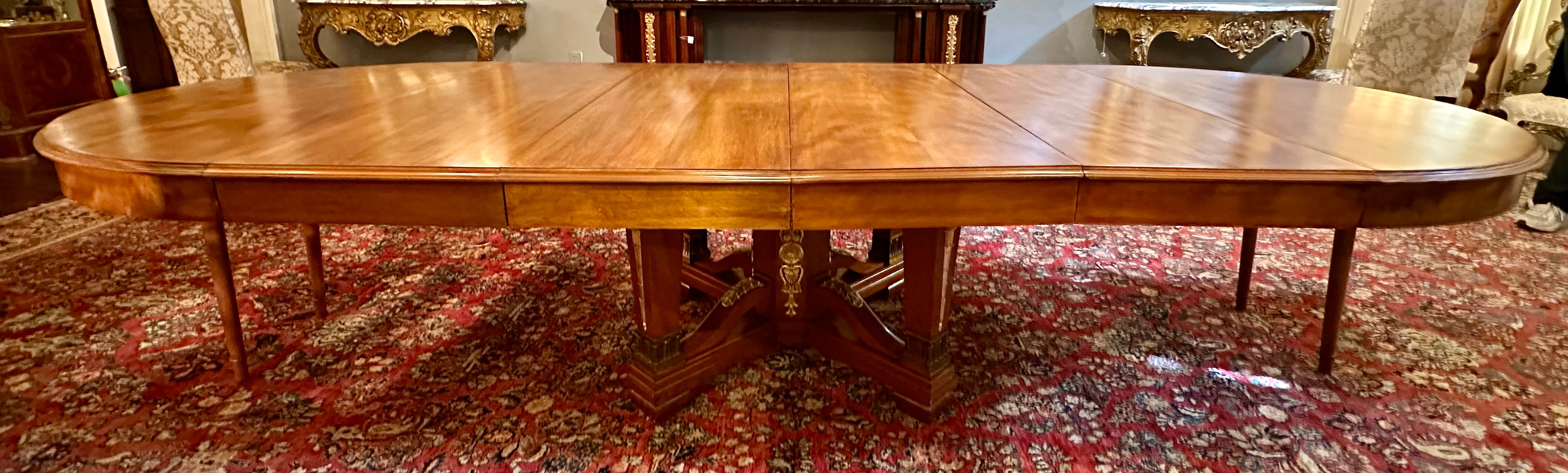 Antique French Empire Bronze D' Ore Mounted Mahogany Dining Table, Circa 1890.
Photographed with the leaves in it at 11 feet 1 inch
Breaks down to a 55