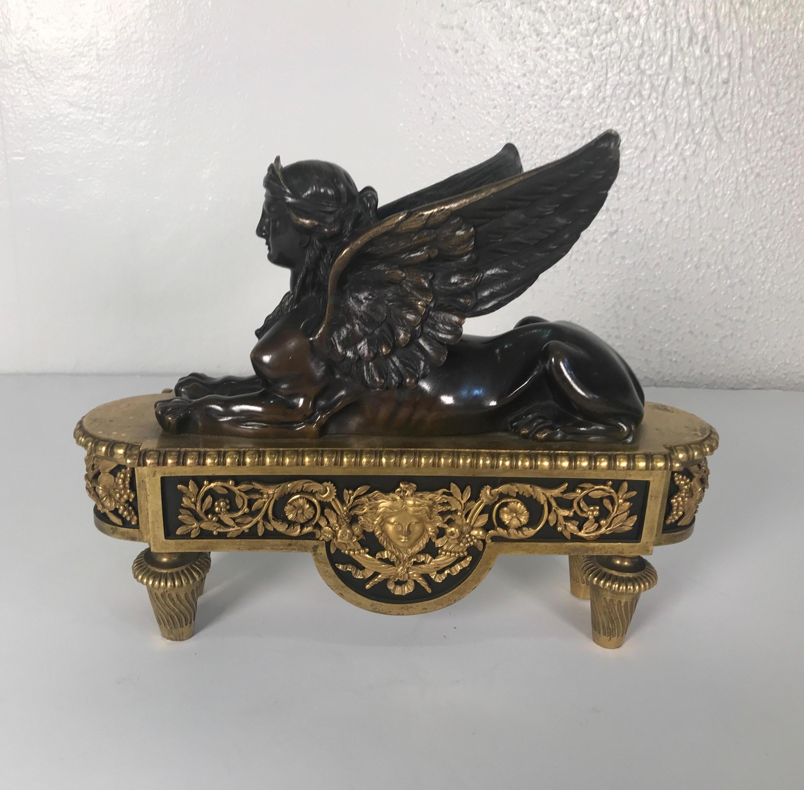 Beautifully cast French Empire patinated and gilt bronze winged sphinx. The original dark warm patination with original gilt base. The underside showing the handcut blots that date this to circa 1840-1850.