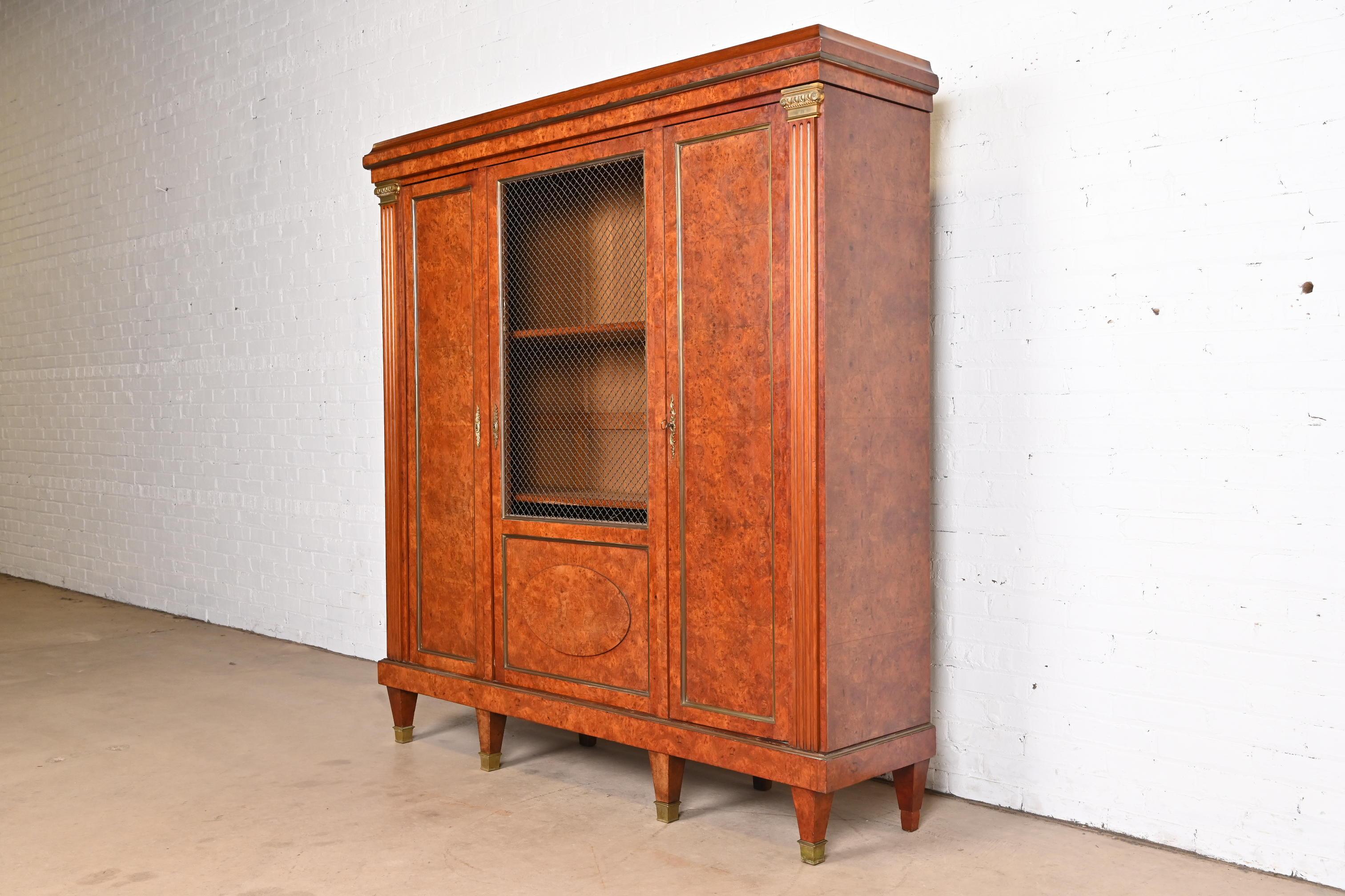 A beautiful antique French Empire knockdown bibliotheque bookcase cabinet

In the manner of Louis Majorelle

France, Circa 1880s

Gorgeous burl wood, with bronze mounts and trim.

Measures: 67.75
