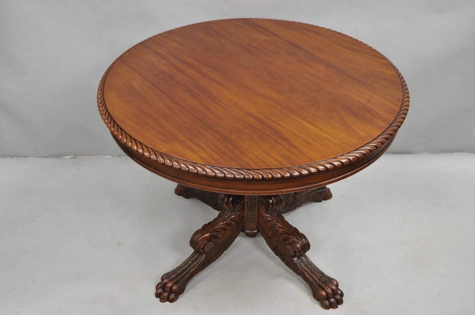 Antique French Empire Carved Mahogany Paw Foot Acanthus Pedestal Base Round Center Table with Carved Rope Edge. Appears to have been professionally refinished at some point over the years. Circa Late 19th Century. Measurements: 29.5