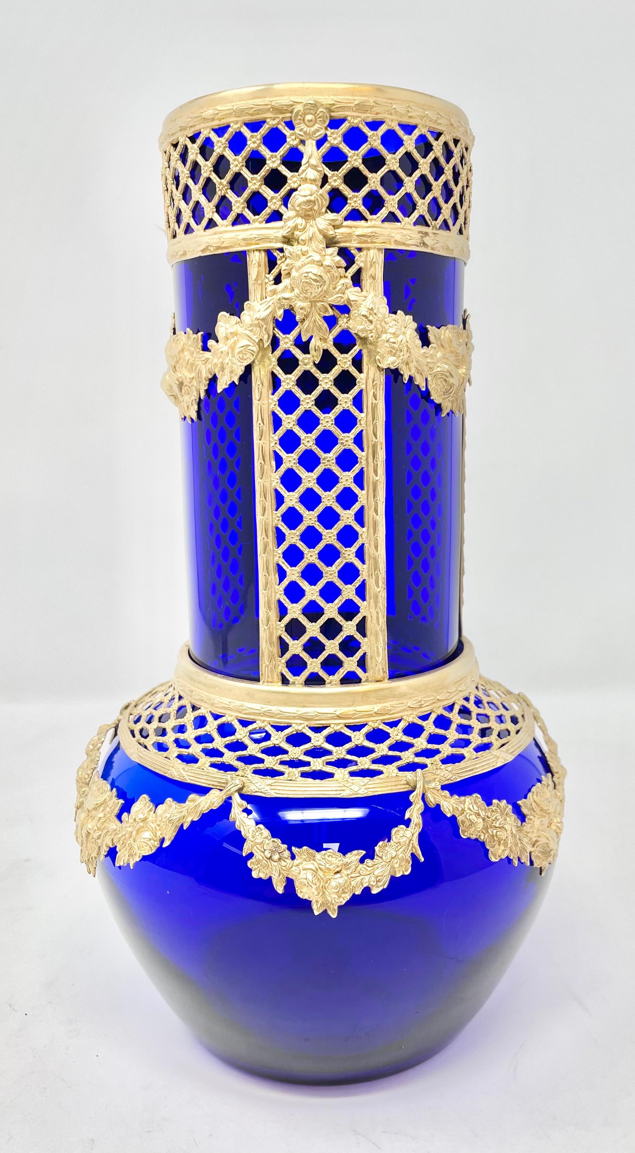 Fine Antique French Empire cobalt blue glass & intricate gold bronze mounted vase, circa 1900.
Cobalt Glass has a beautiful glow in the light.