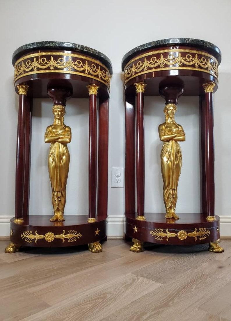 A scarce pair of exquisite French Empire style gilt bronze mounted mahogany stands in the manner of important royal ébéniste Jacob-Desmalter (1770–1841; Paris, France). circa 1880

Hand-crafted in France in the late 19th to early 20th century,