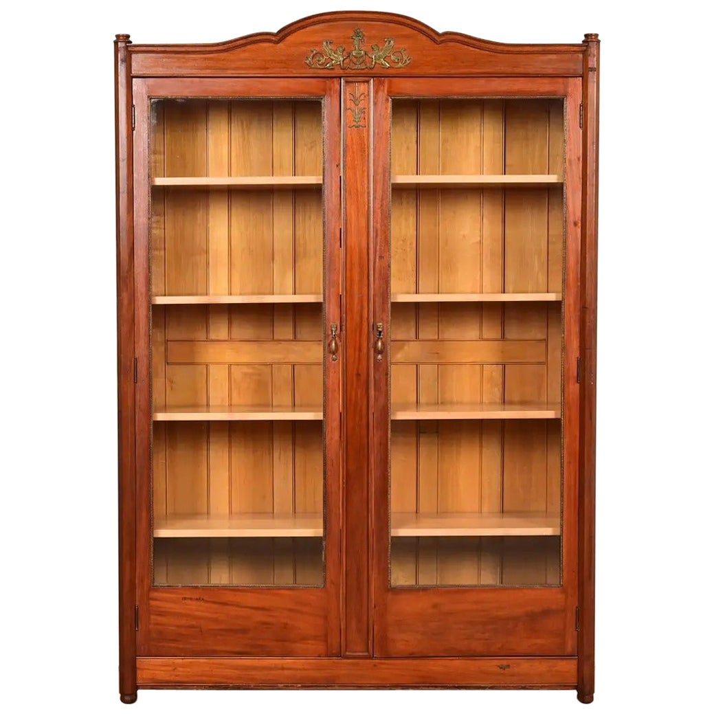 Ancienne bibliothèque Empire française en acajou avec bronze doré monté