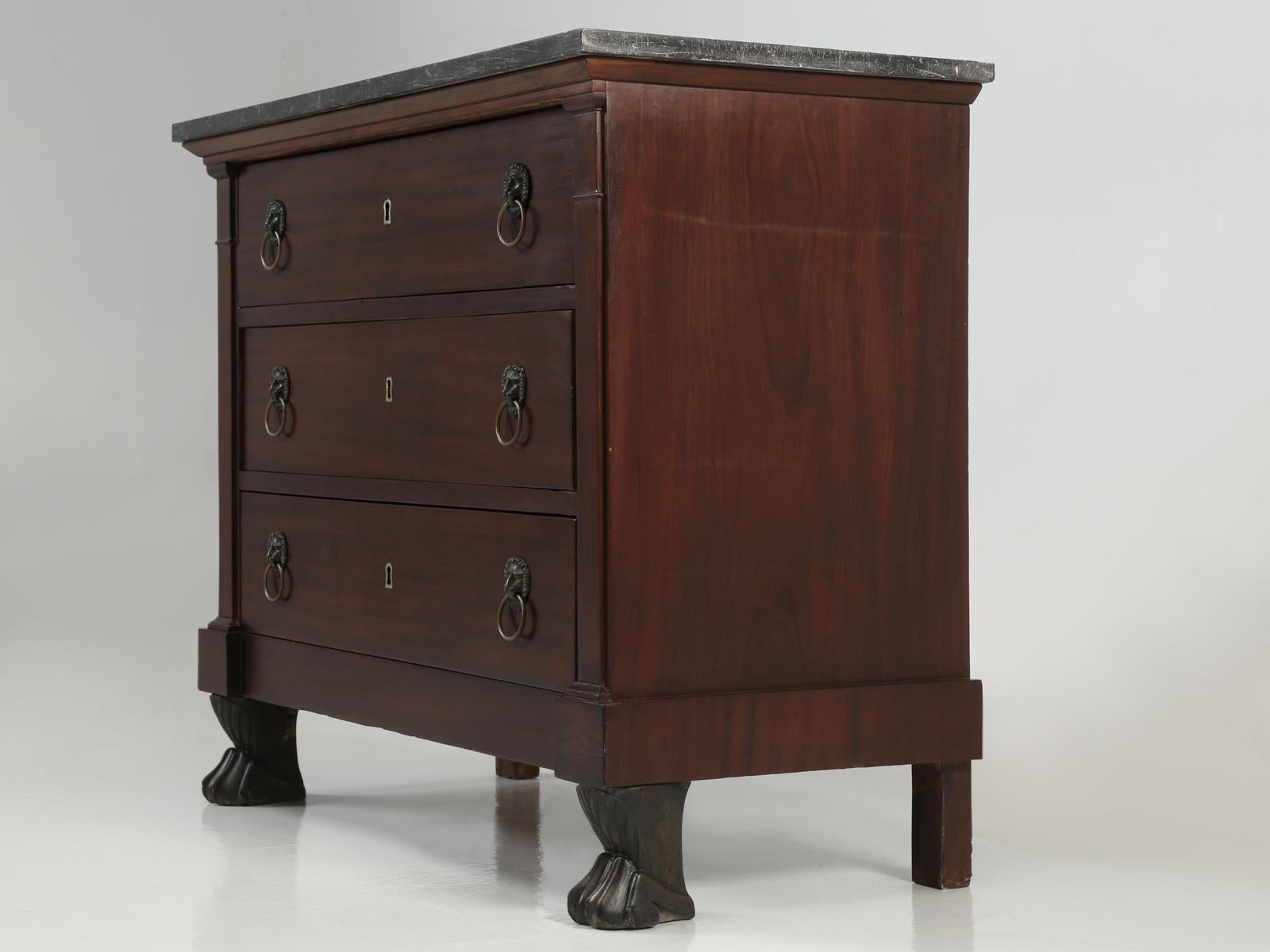 Antique French Empire style Commode or some may describe our Lion Paw Foot Commode as from the Restauration period, which was predominantly Neoclassicism. Our Old Plank restoration department completely rebuilt the drawers and the entire frame, but