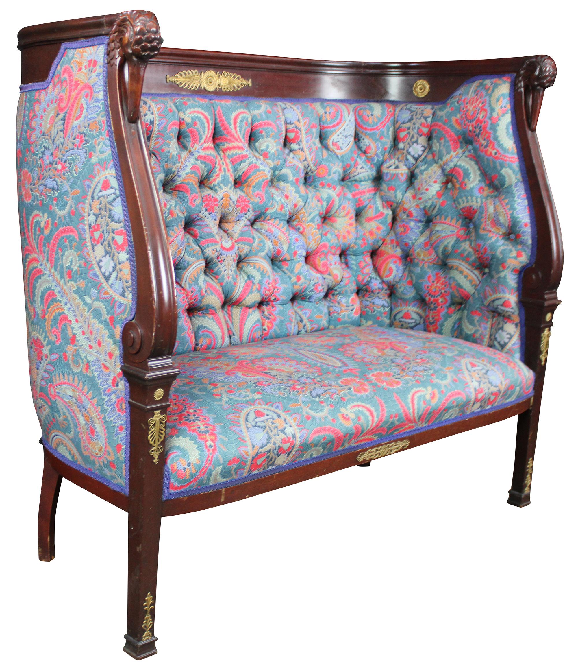 Antique French Empire figural high back settee. Features tufted modern vibrant paisley upholstery with tall rounded back, gilt accents, and carved swan / bird head arms. Measure: 53